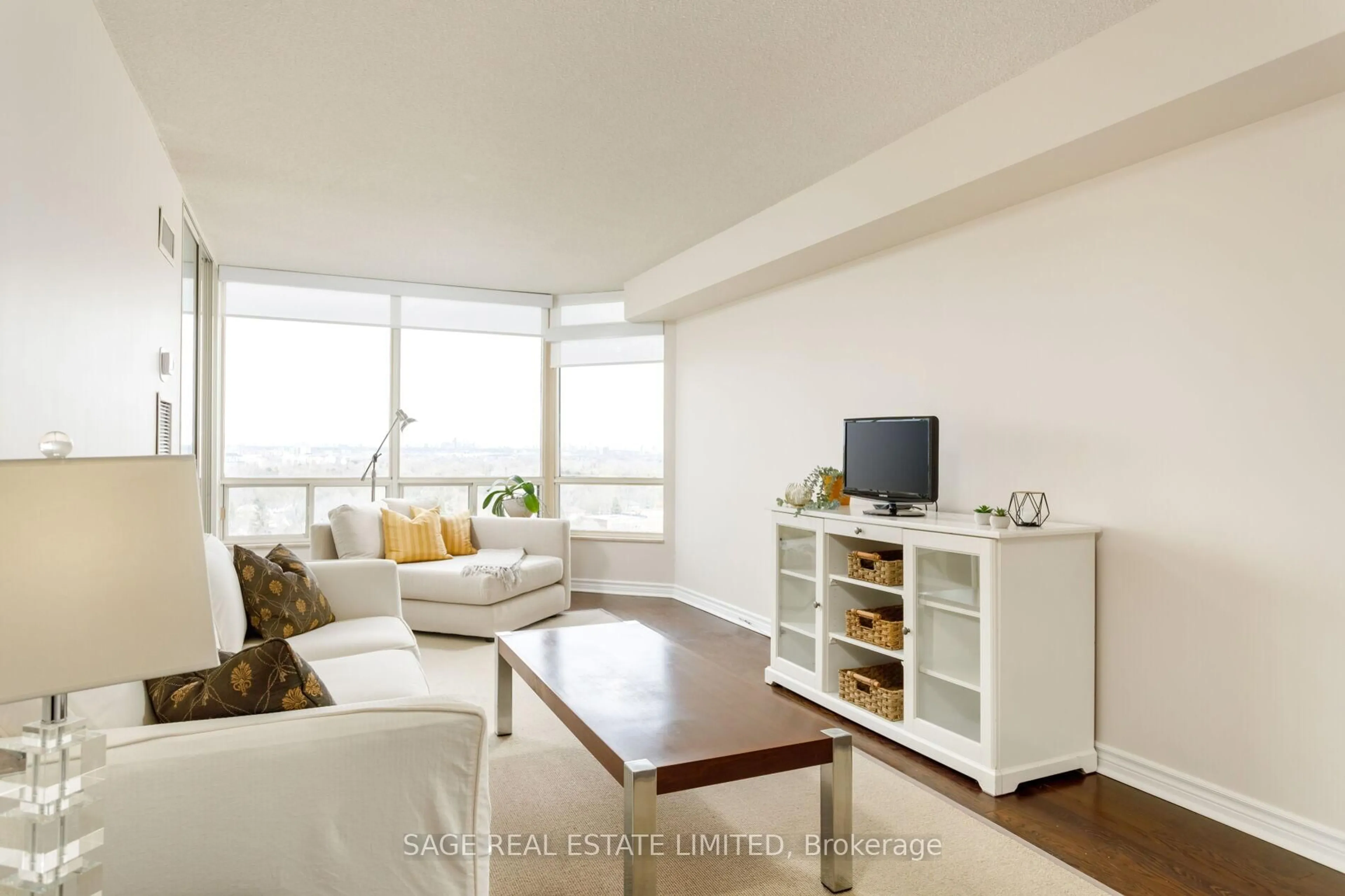 Living room with furniture, wood/laminate floor for 1300 Islington Ave #1705, Toronto Ontario M9A 5C4