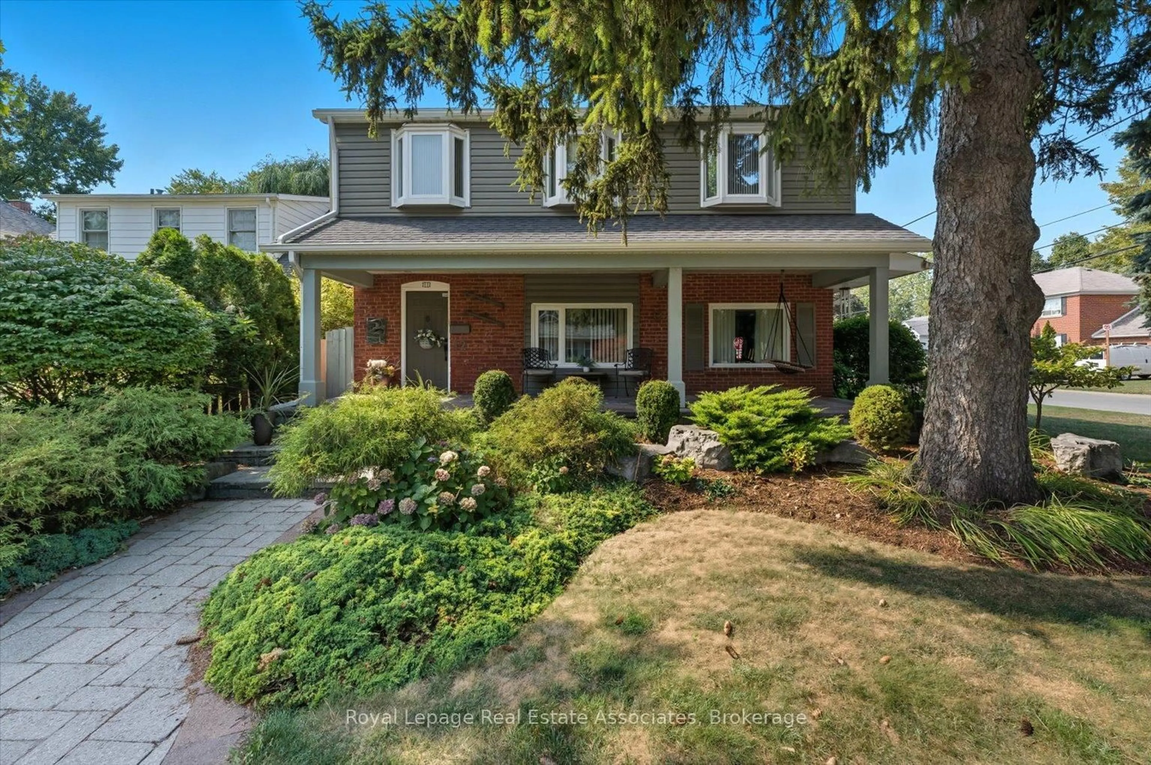 Home with brick exterior material, street for 12 Wenonah Dr, Mississauga Ontario L5G 3W1