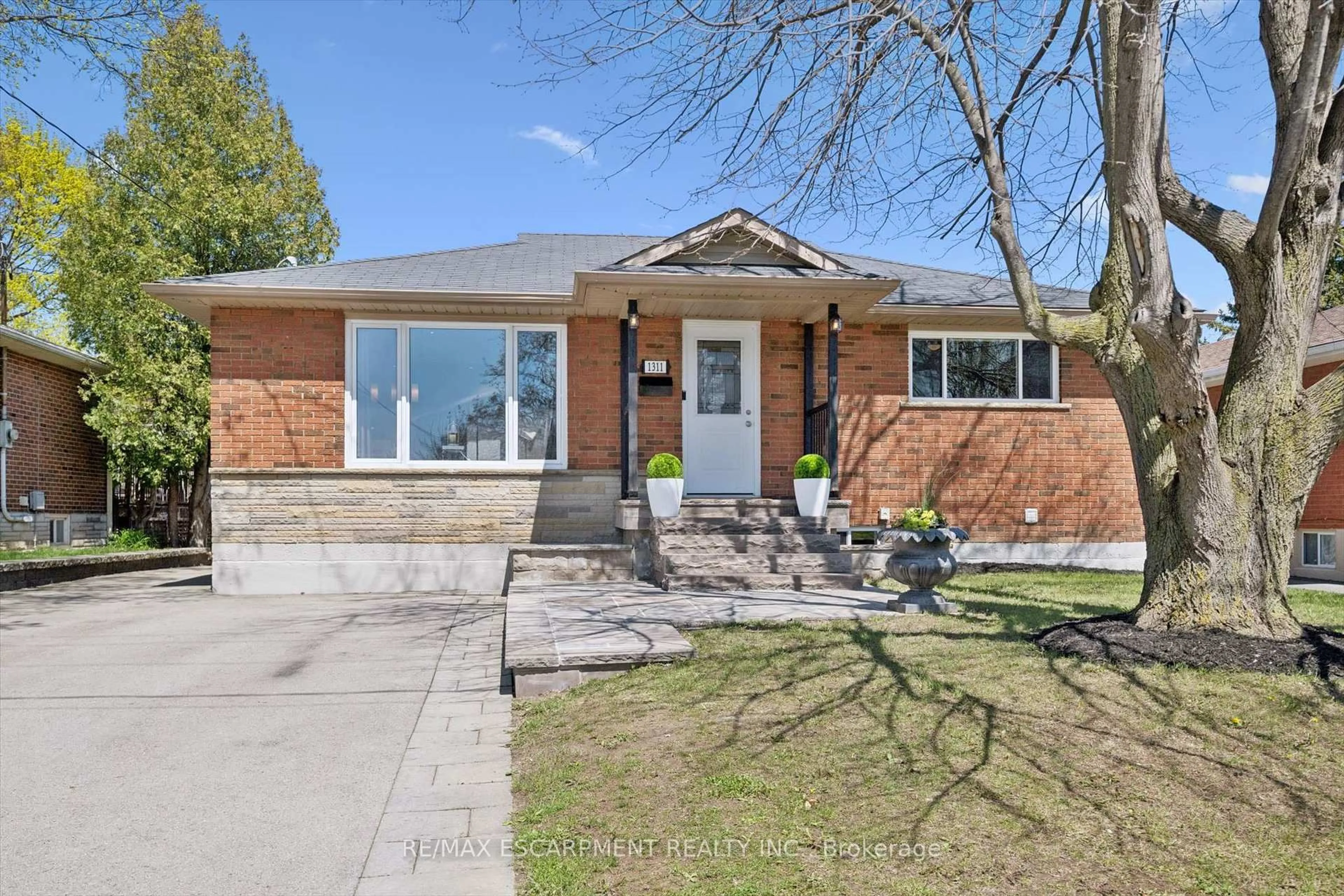 Home with brick exterior material, street for 1311 Royal Dr, Burlington Ontario L7P 2G2