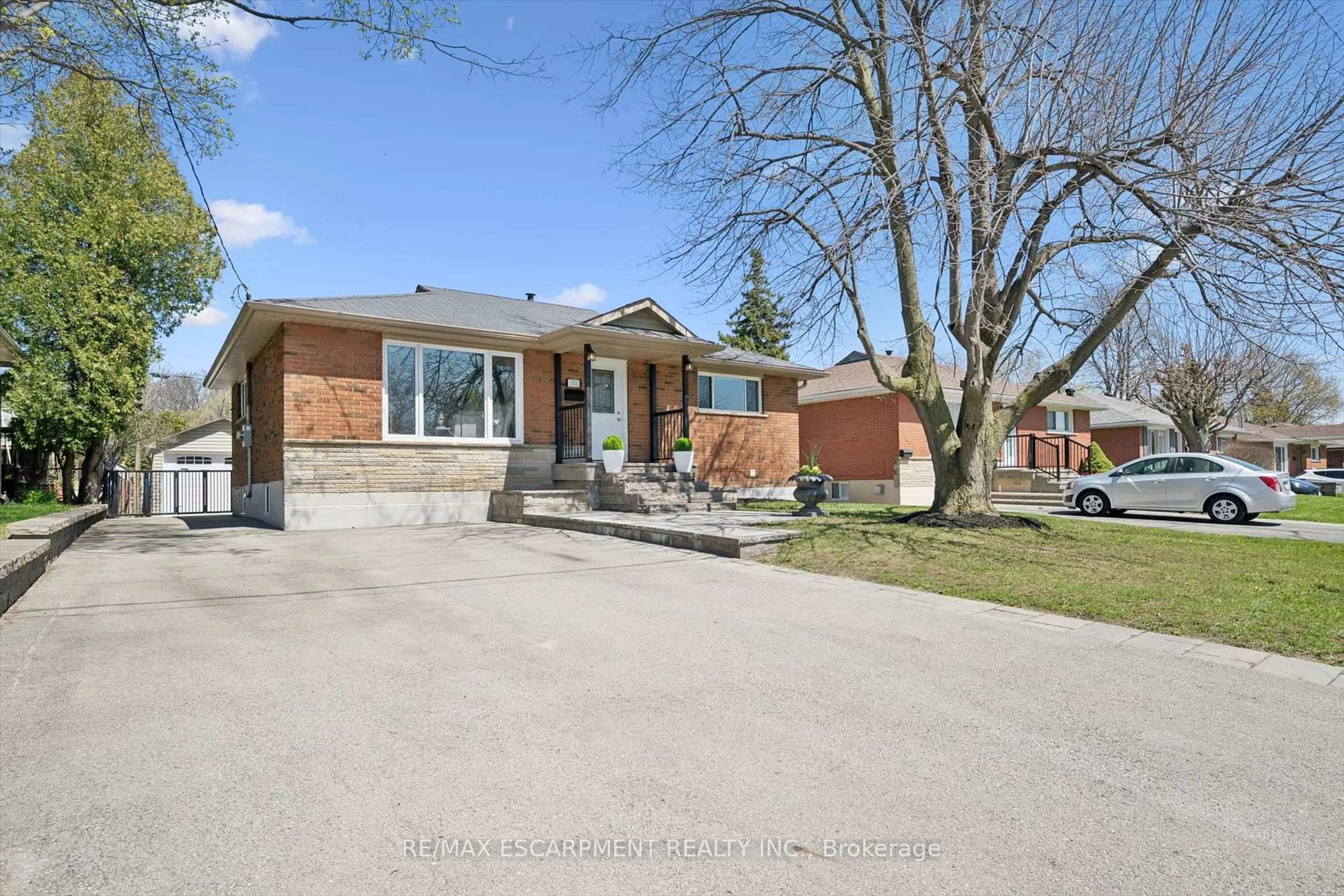 Home with brick exterior material, street for 1311 Royal Dr, Burlington Ontario L7P 2G2