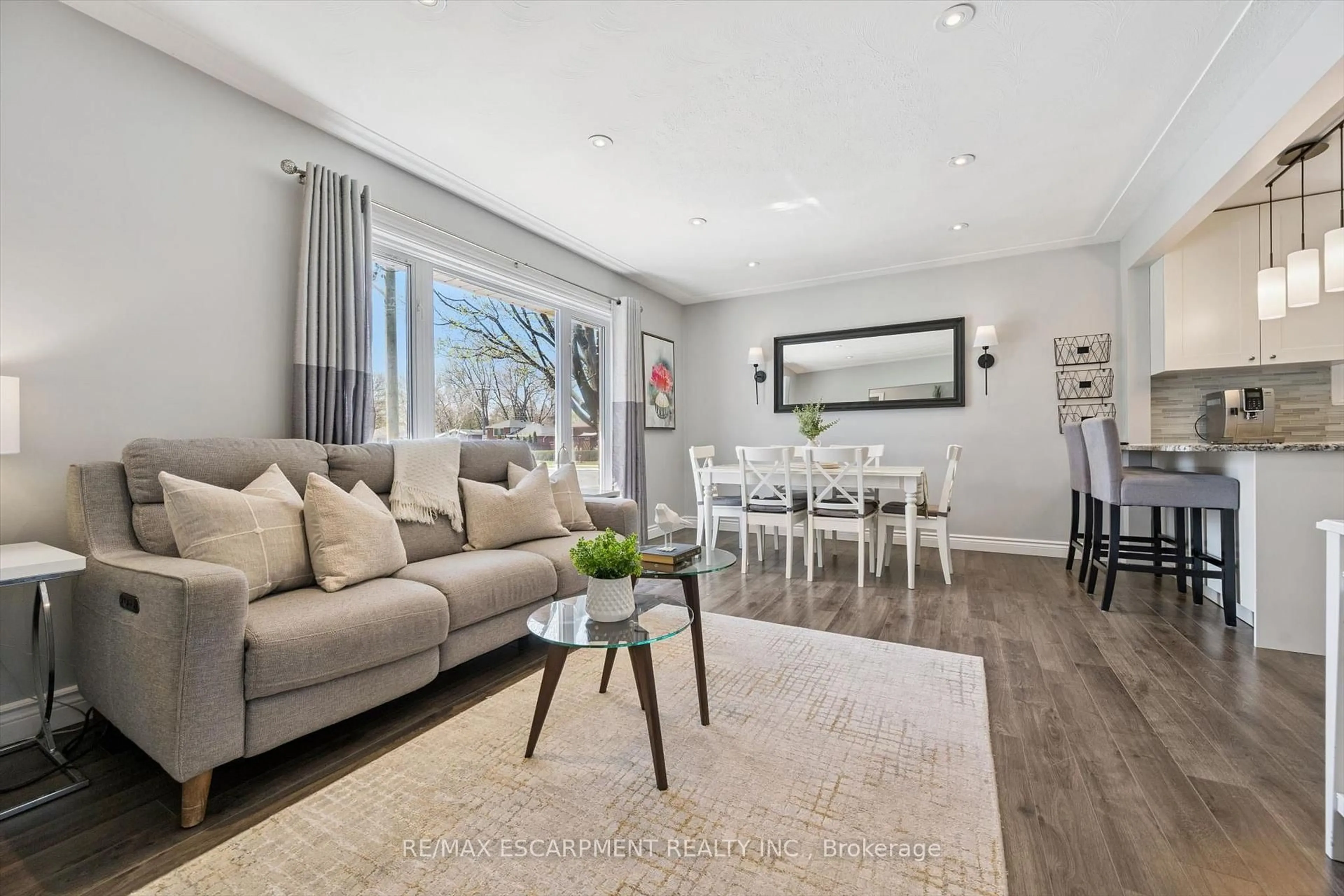 Living room with furniture, wood/laminate floor for 1311 Royal Dr, Burlington Ontario L7P 2G2