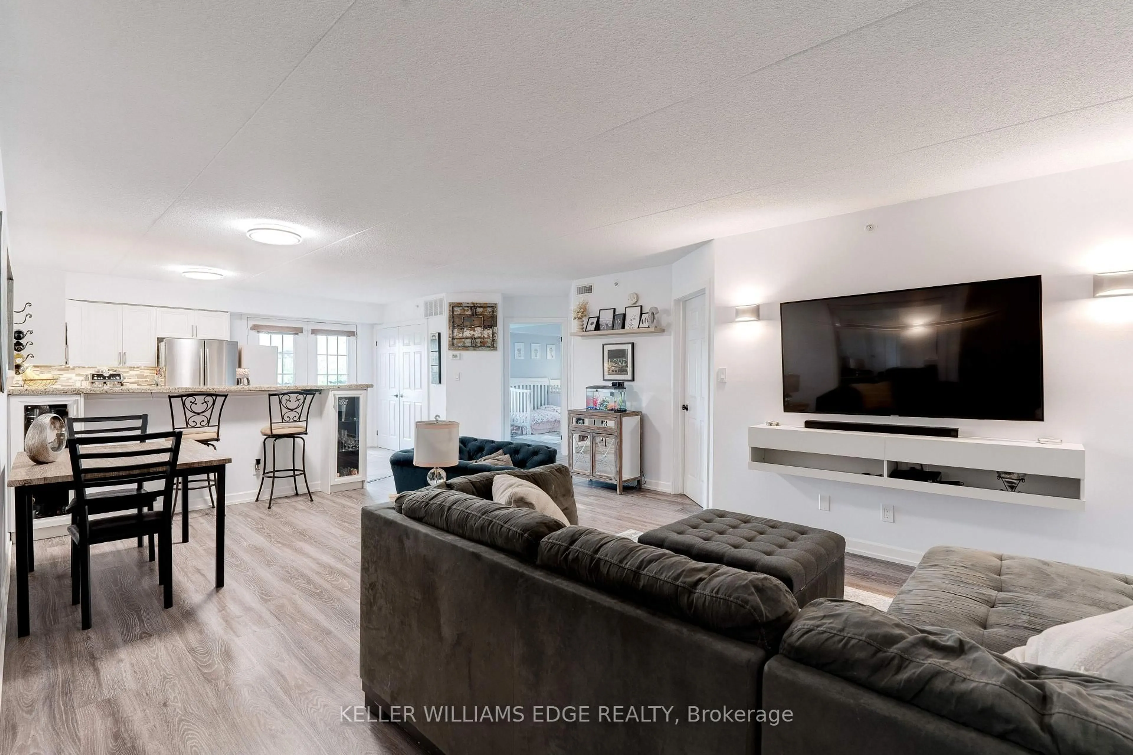 Living room with furniture, wood/laminate floor for 1800 Walker's Line #302, Burlington Ontario L7M 4V2