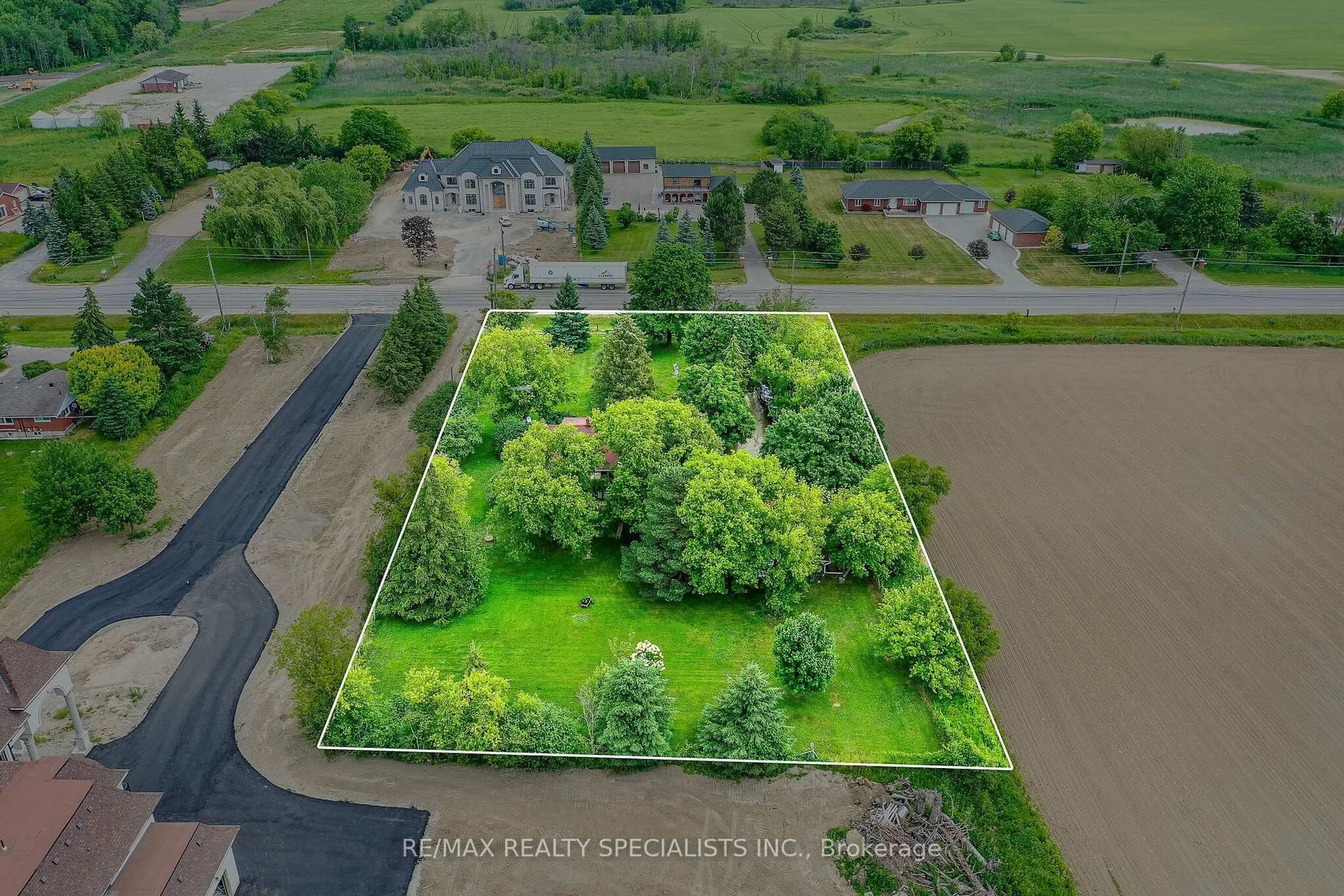 A pic from outside/outdoor area/front of a property/back of a property/a pic from drone, water/lake/river/ocean view for 15208 Airport Rd, Caledon Ontario L7C 2W7