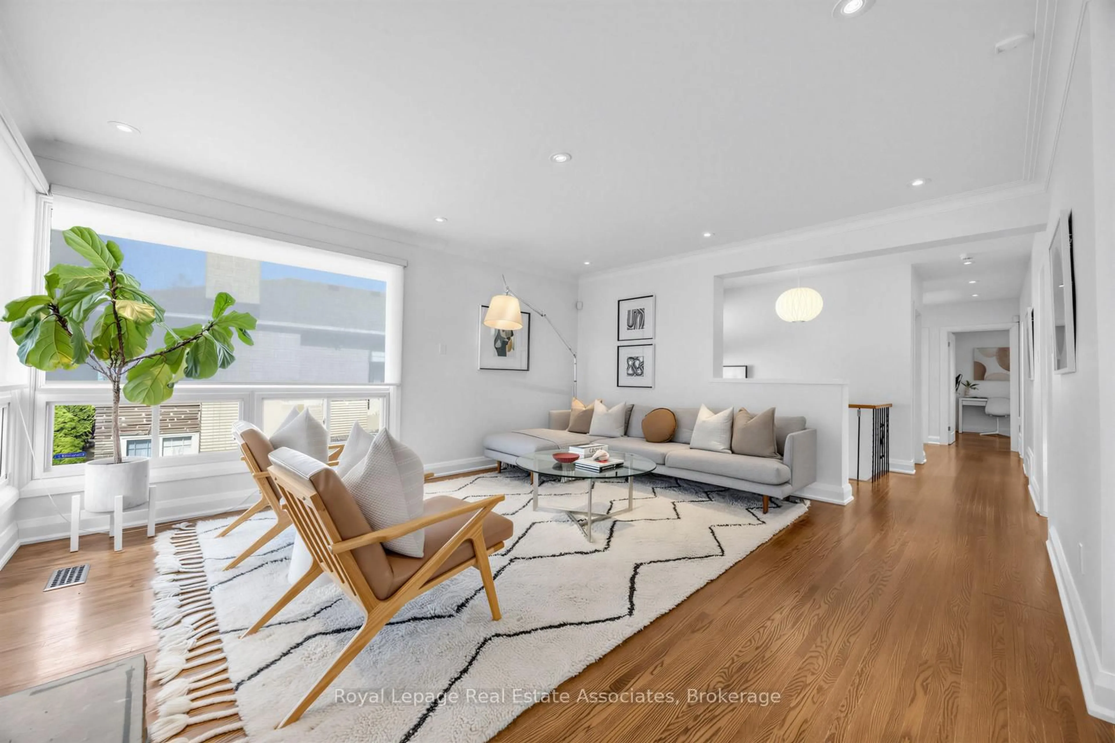 Living room with furniture, wood/laminate floor for 21 Sturton Rd, Toronto Ontario M9P 2C7