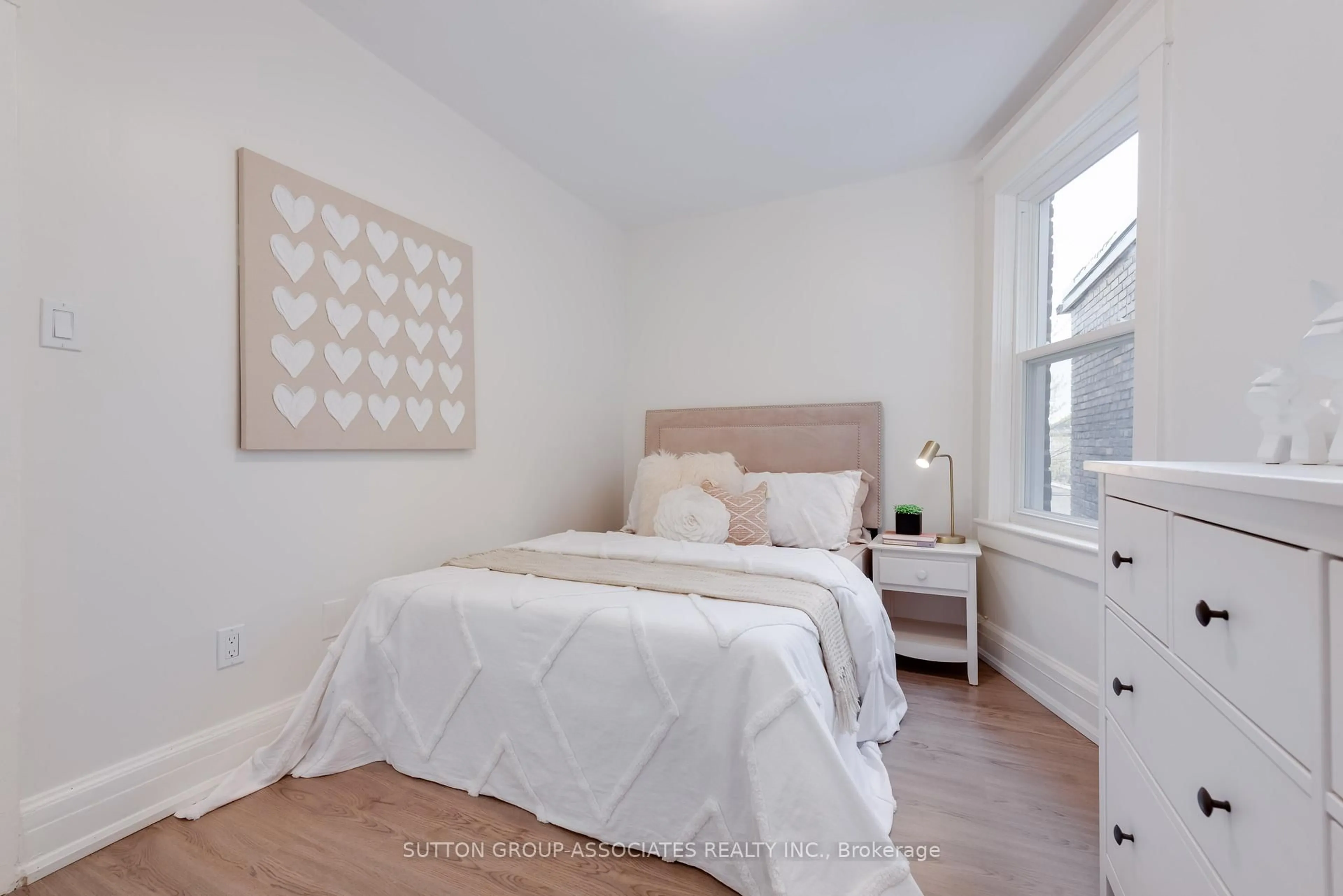 Bedroom with bed, wood/laminate floor for 131 Ascot Ave, Toronto Ontario M6E 1G3