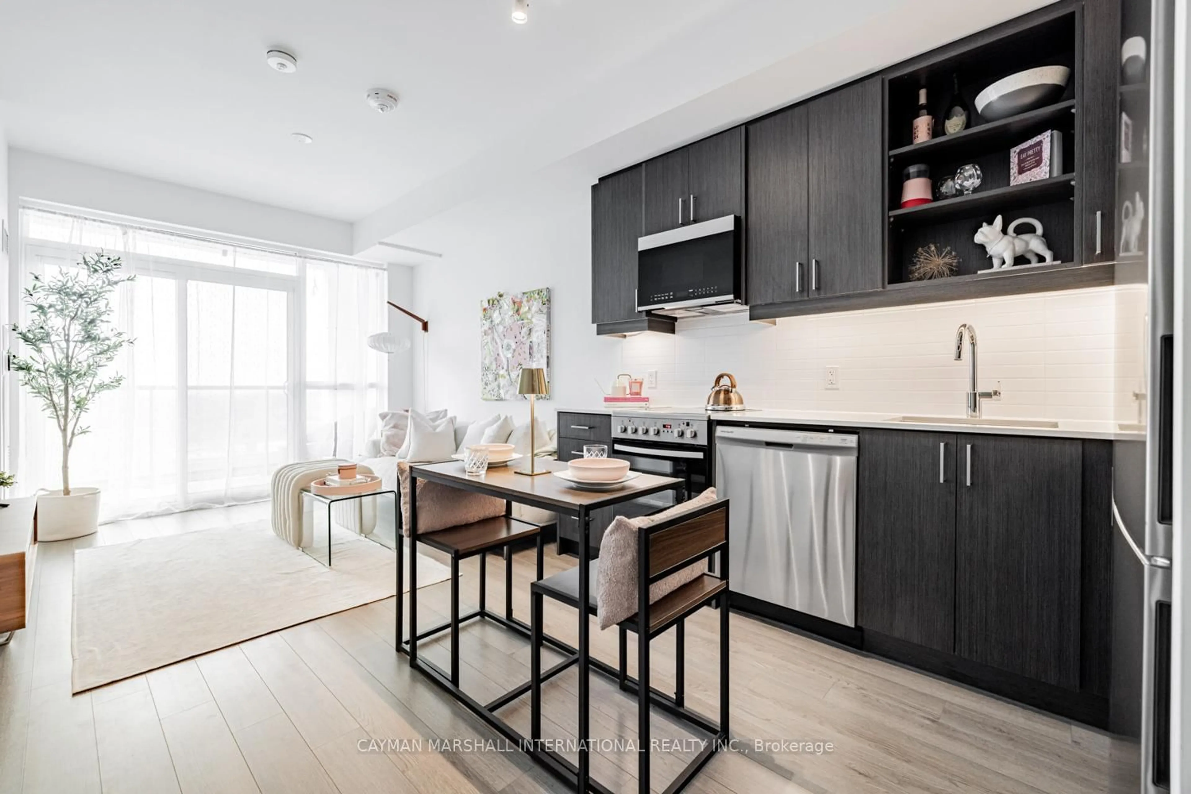 Open concept kitchen, wood/laminate floor for 50 George Butchart Dr #524, Toronto Ontario M3K 0C9