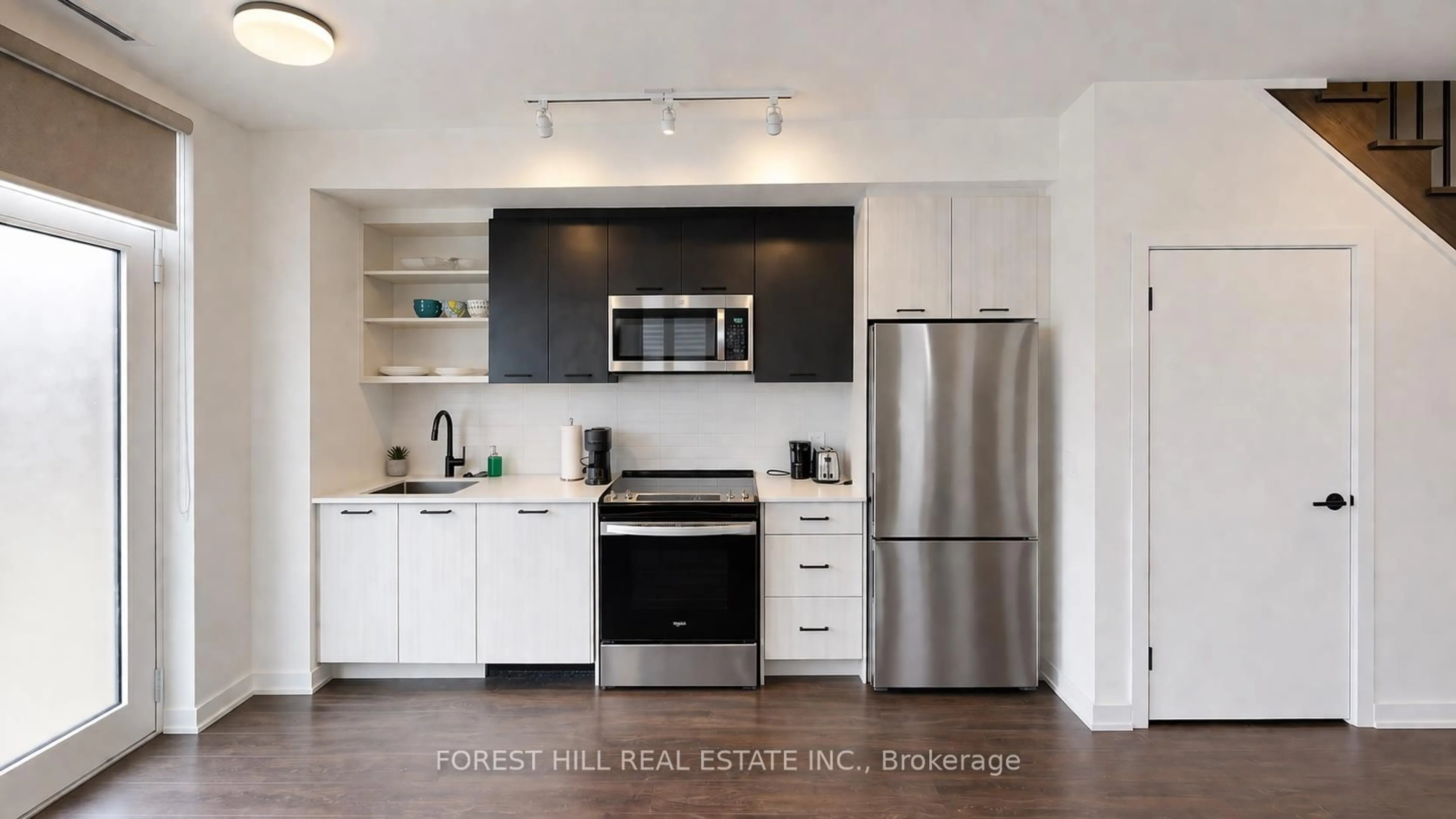 Open concept kitchen, wood/laminate floor for 16 Symes Rd #104, Toronto Ontario M6N 0B4