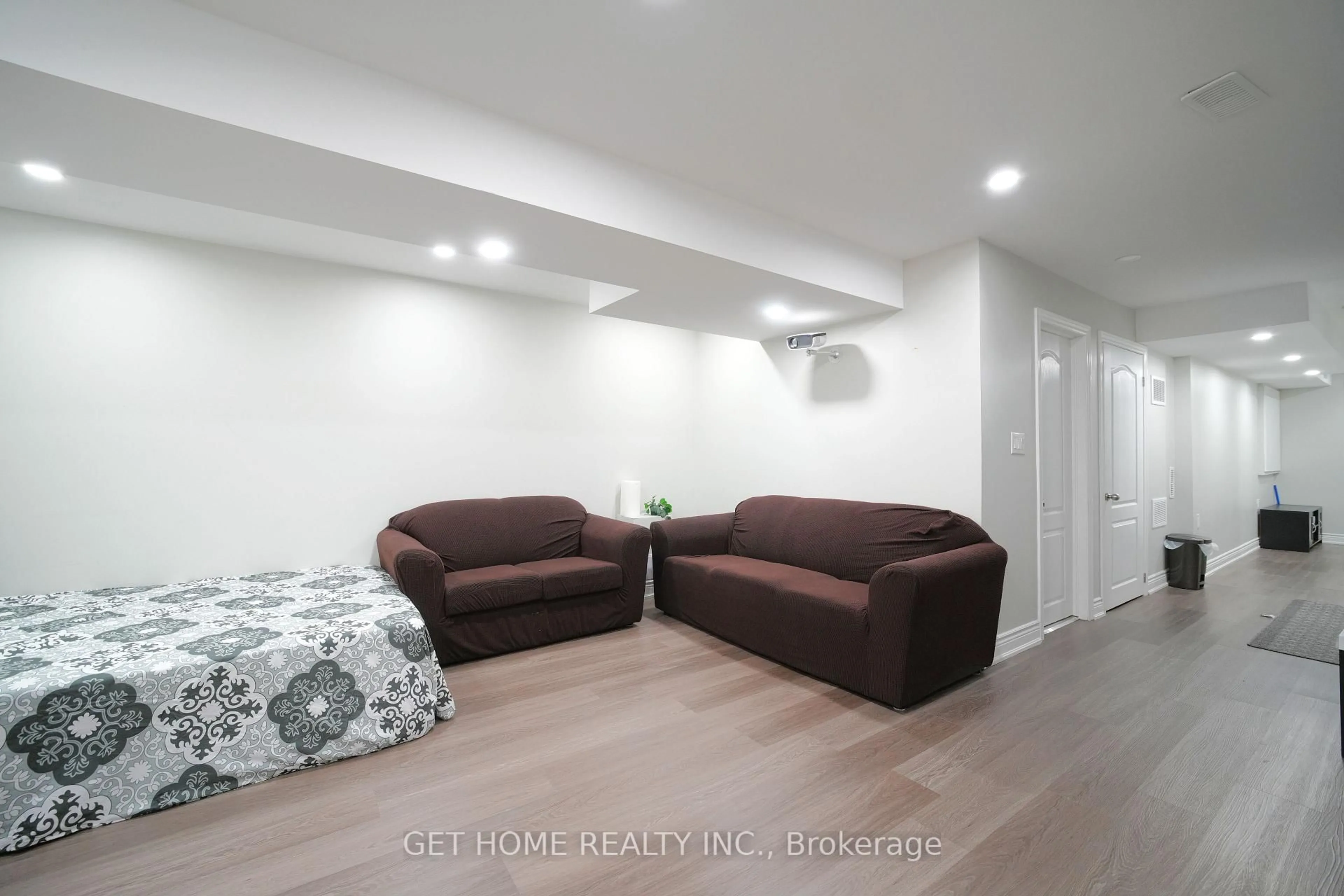 Living room with furniture, wood/laminate floor for 78 Spicebush Terr, Brampton Ontario L6X 0J4