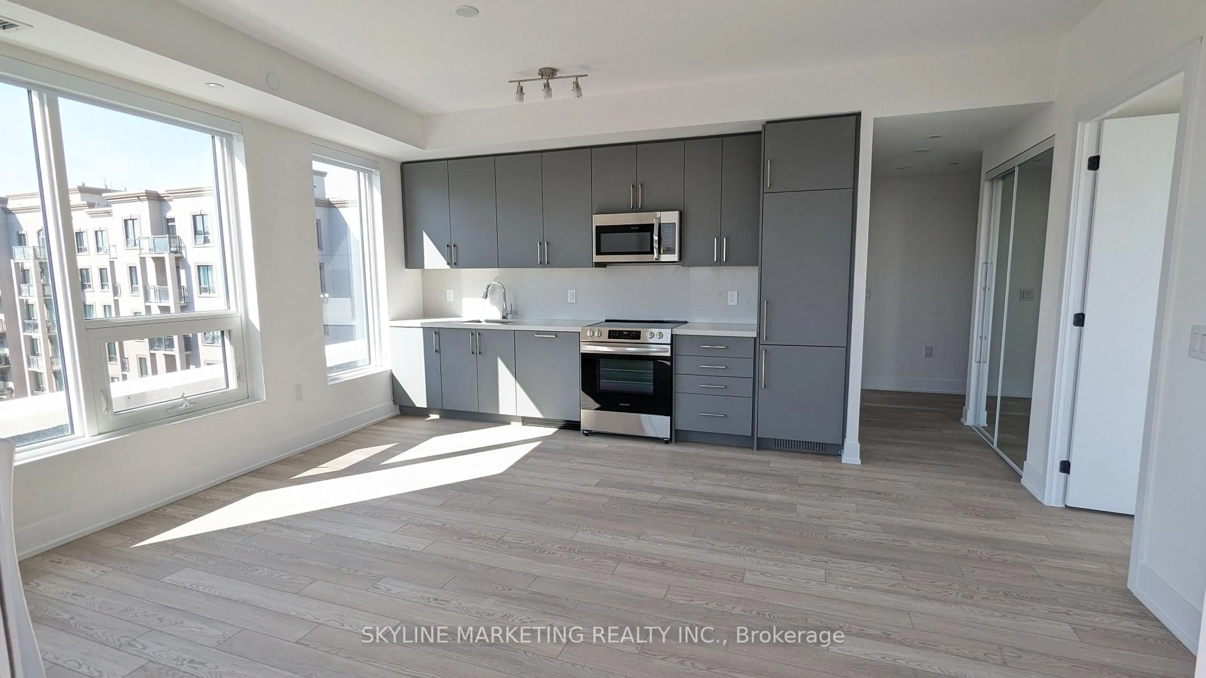 Open concept kitchen, wood/laminate floor for 2450 Old Bronte Rd #733, Oakville Ontario L6M 5P6