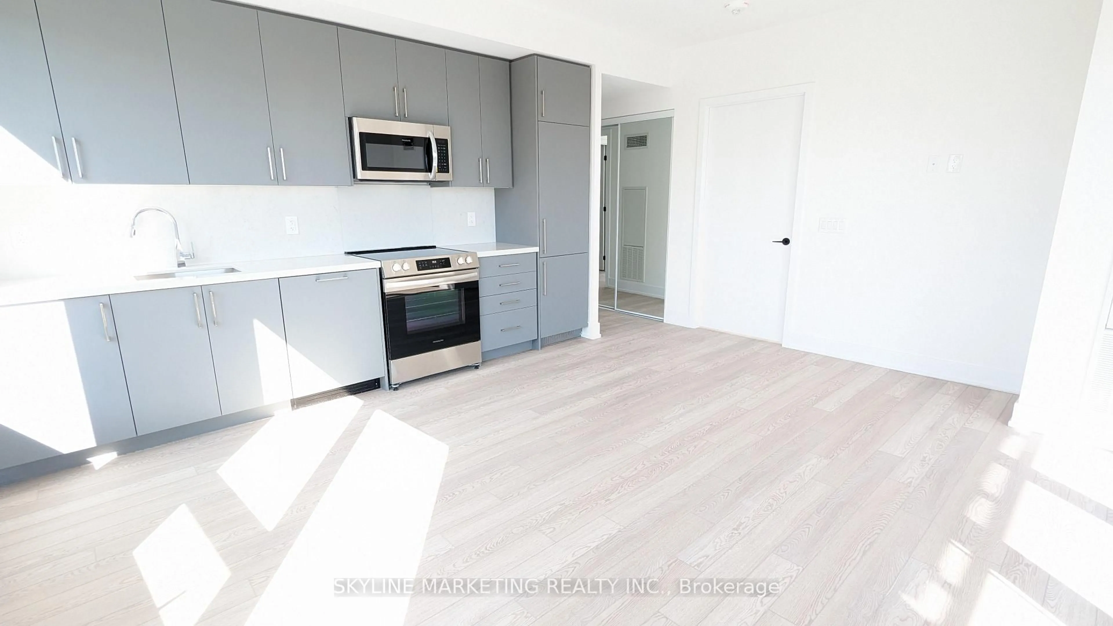 Open concept kitchen, wood/laminate floor for 2450 Old Bronte Rd #733, Oakville Ontario L6M 5P6