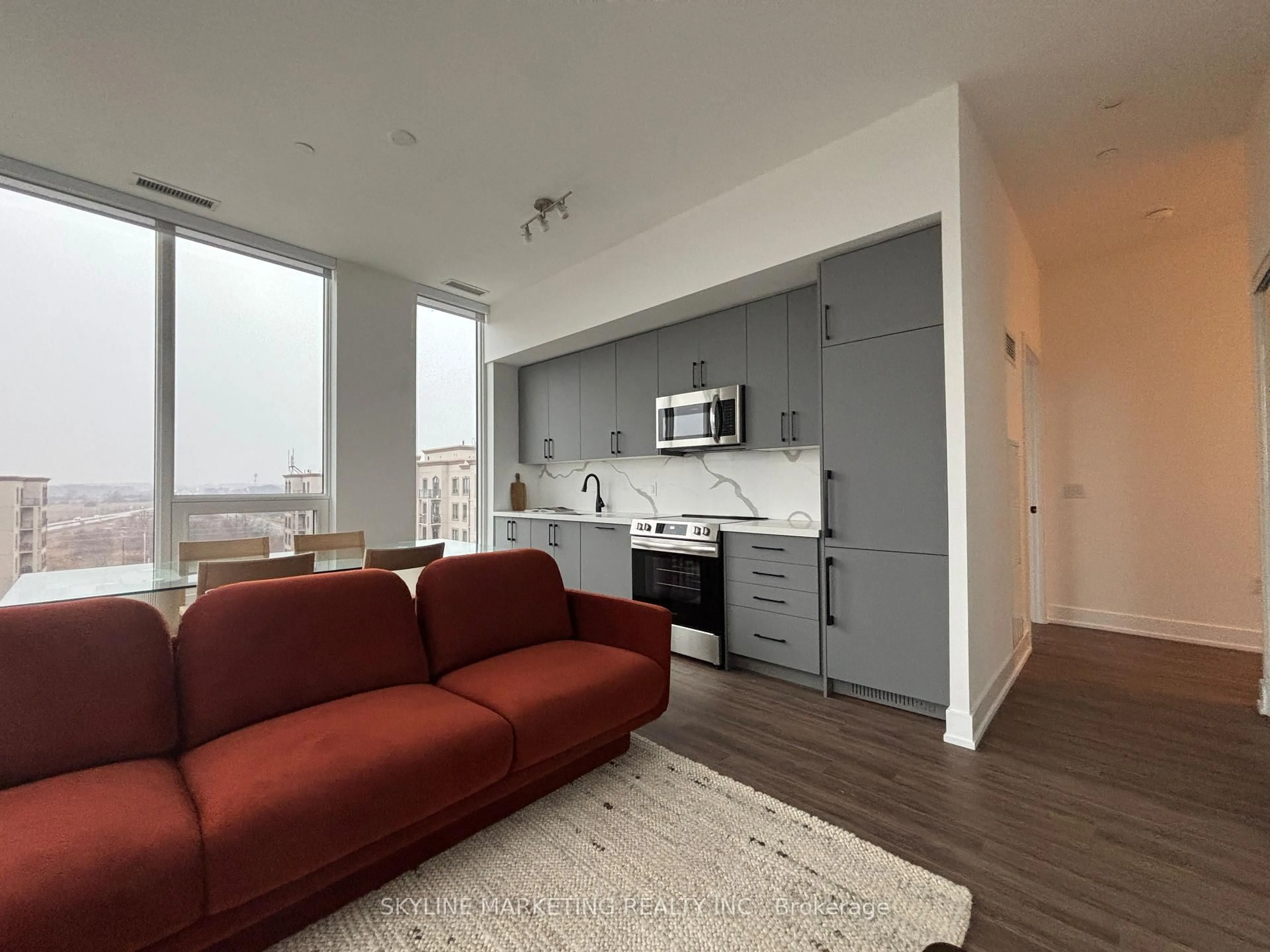 Living room with furniture, unknown for 2450 Old Bronte Rd #834, Oakville Ontario L6M 5P6