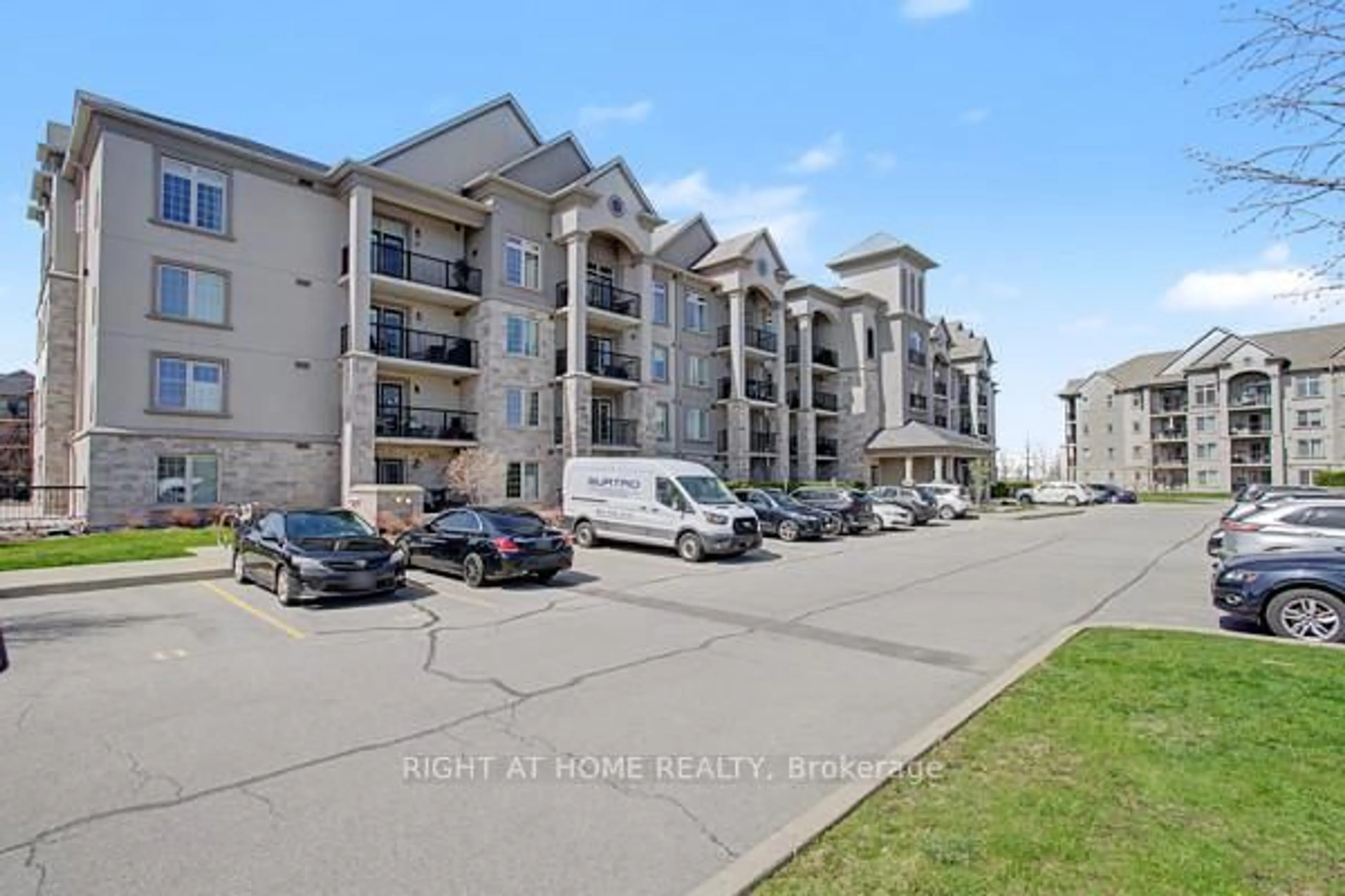 A pic from outside/outdoor area/front of a property/back of a property/a pic from drone, unknown for 1460 Main St #404, Milton Ontario L9T 8W5