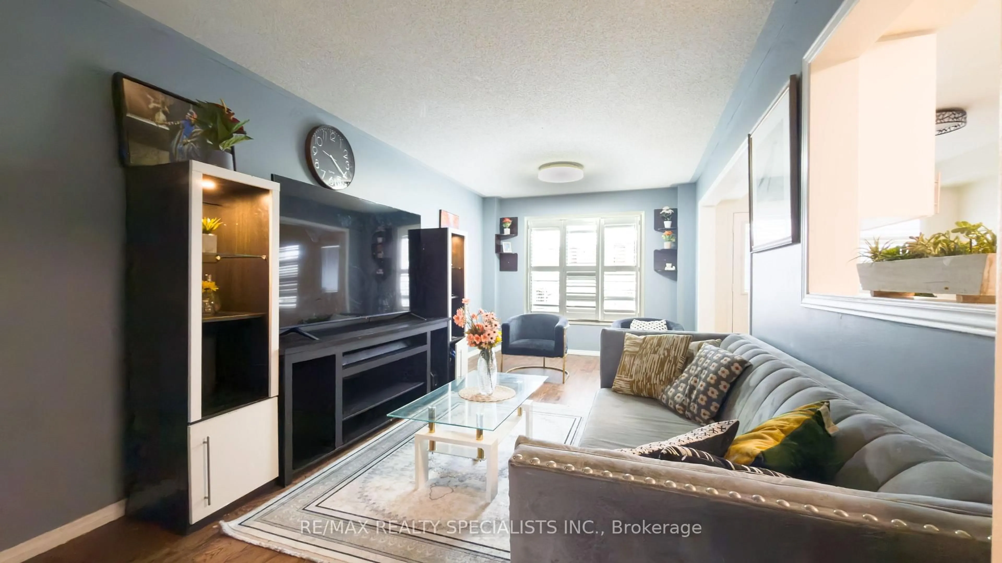 Living room with furniture, wood/laminate floor for 13 Burnstown Circ, Brampton Ontario L6P 3M1