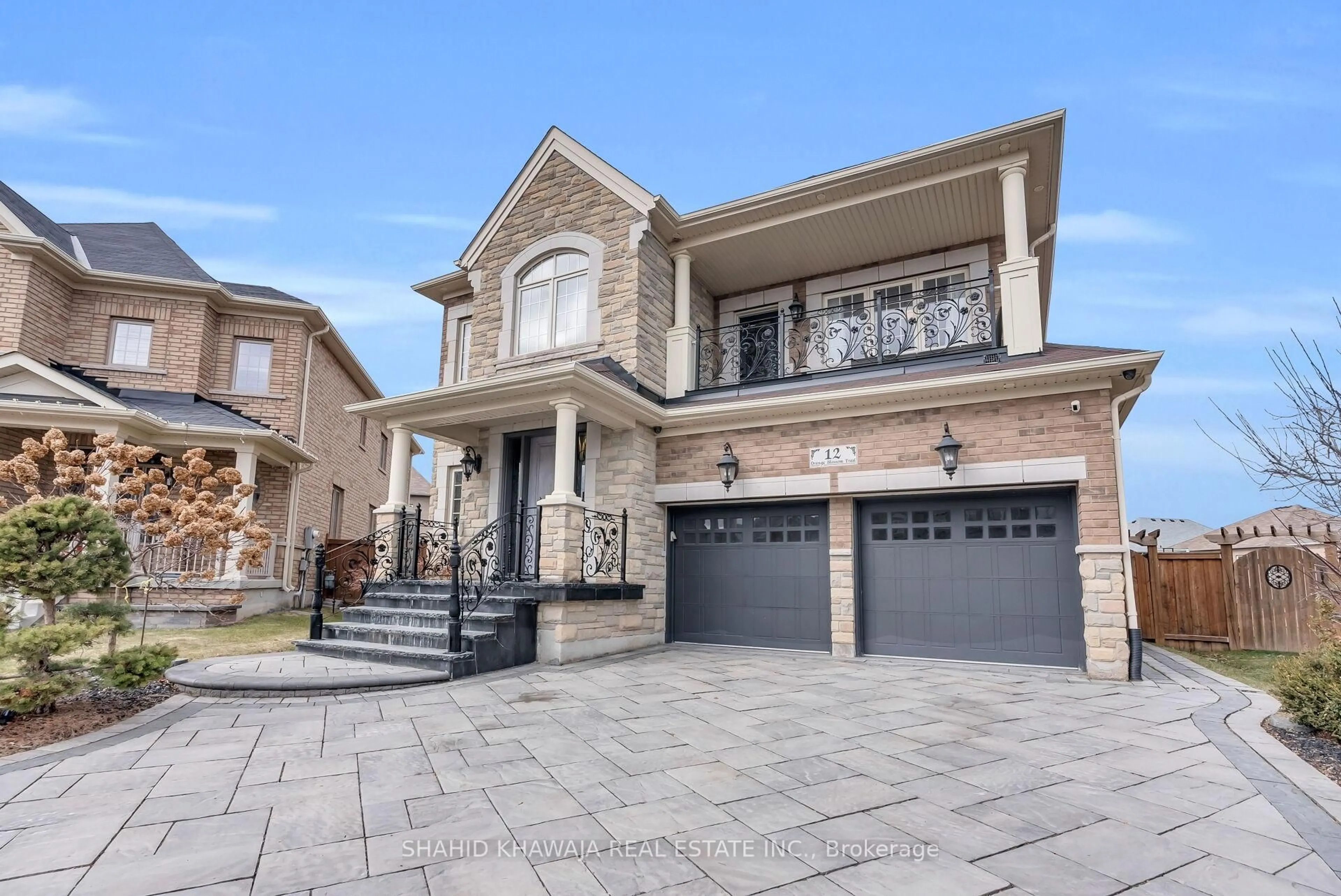 Home with brick exterior material, street for 12 Orangeblossom Tr, Brampton Ontario L6X 3B4