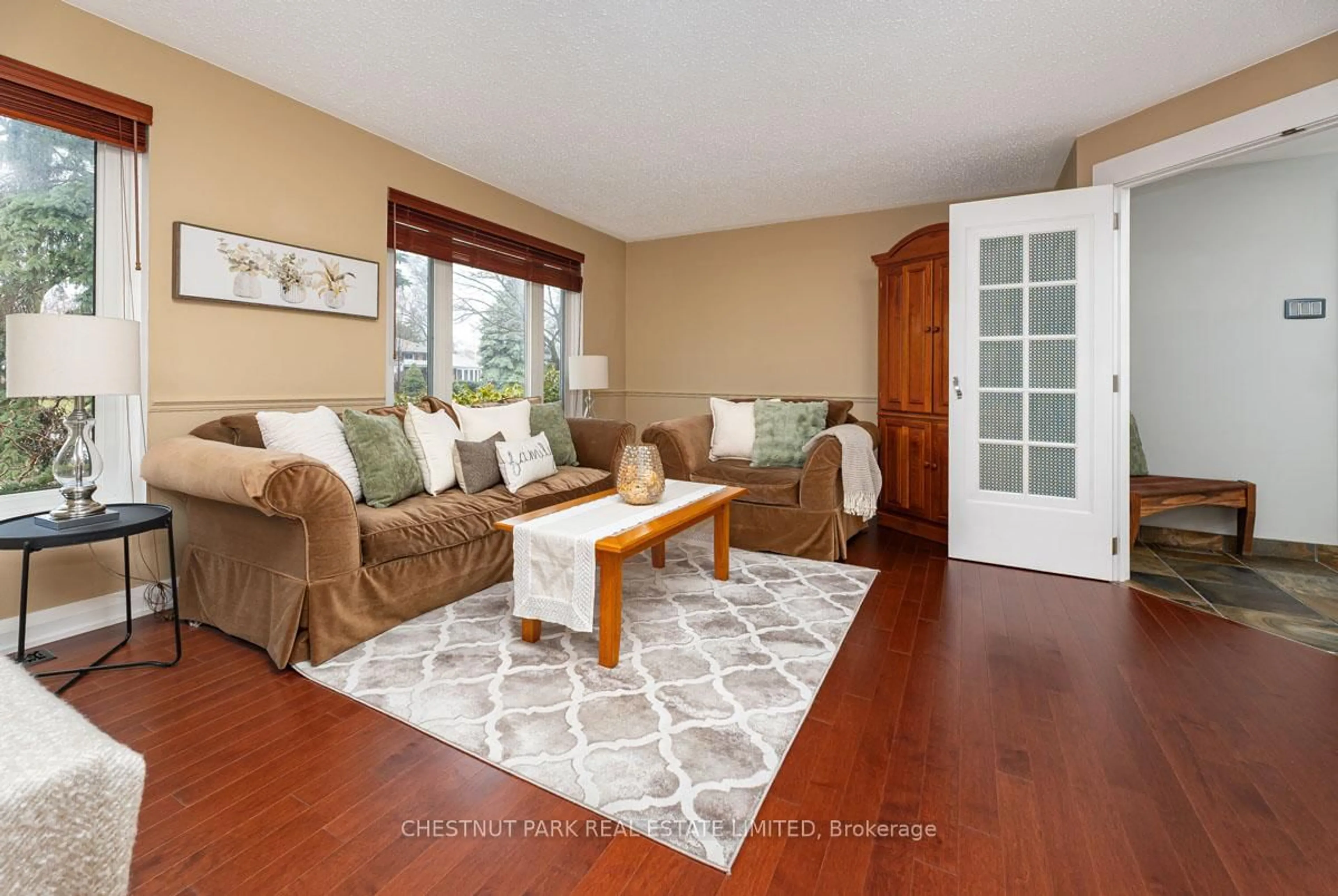 Living room with furniture, wood/laminate floor for 16 Vanderbrent Cres, Toronto Ontario M9R 3W8