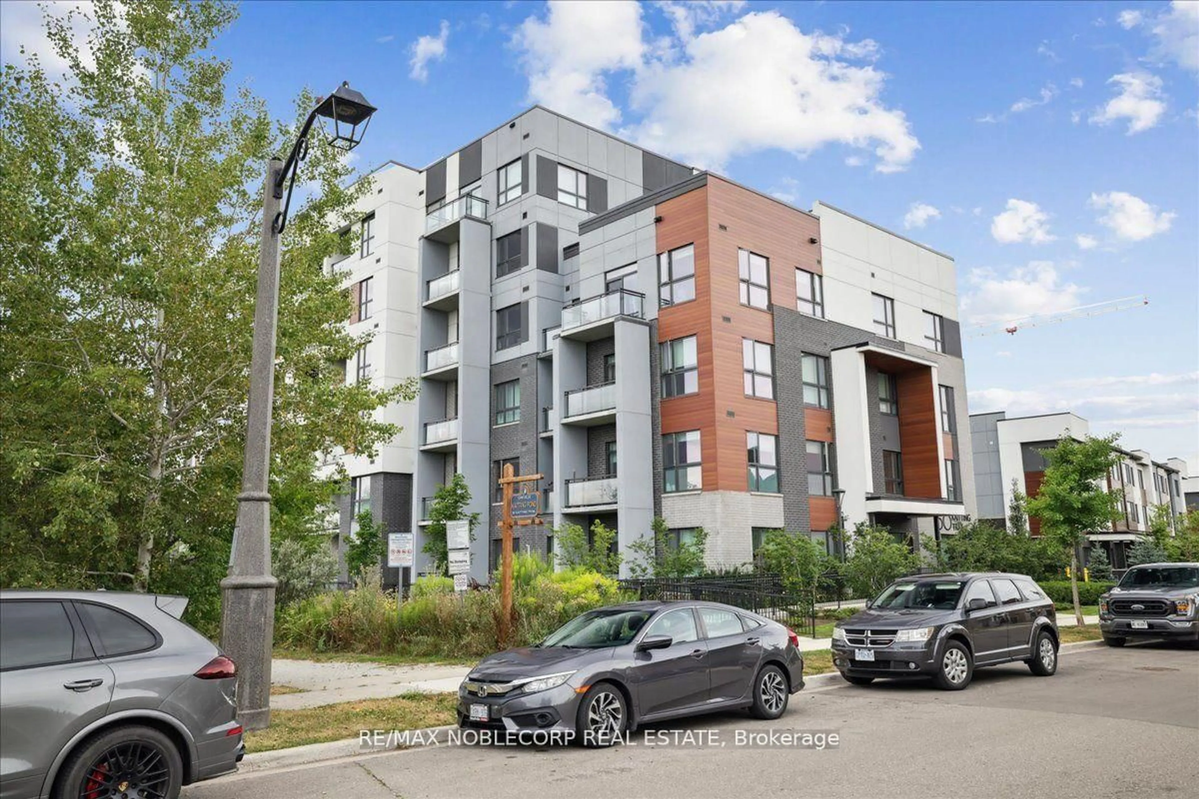 A pic from outside/outdoor area/front of a property/back of a property/a pic from drone, street for 50 Kaitting Tr #516, Oakville Ontario L6M 4L9