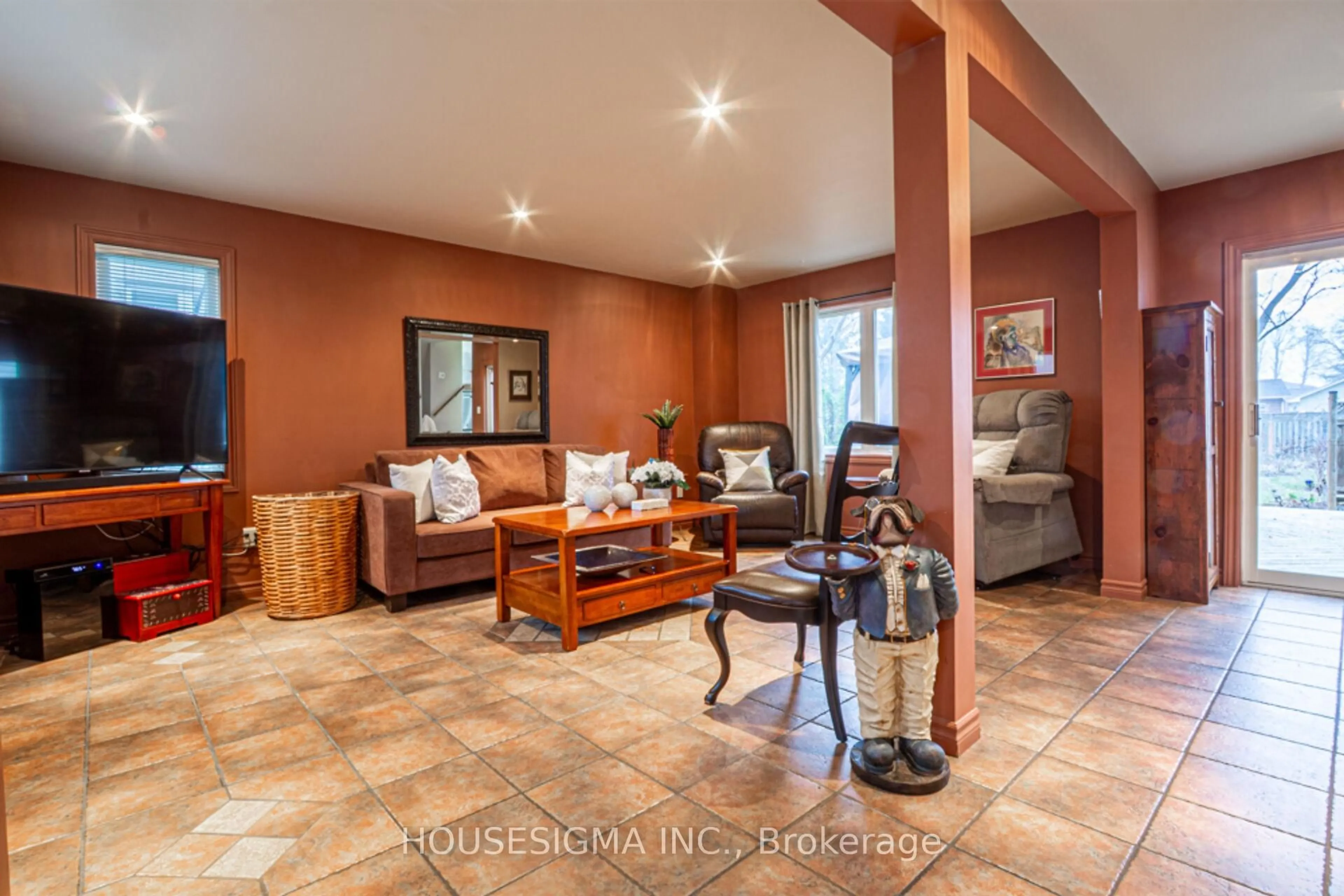 Living room with furniture, ceramic/tile floor for 899 Hazel St, Burlington Ontario L7R 3X1