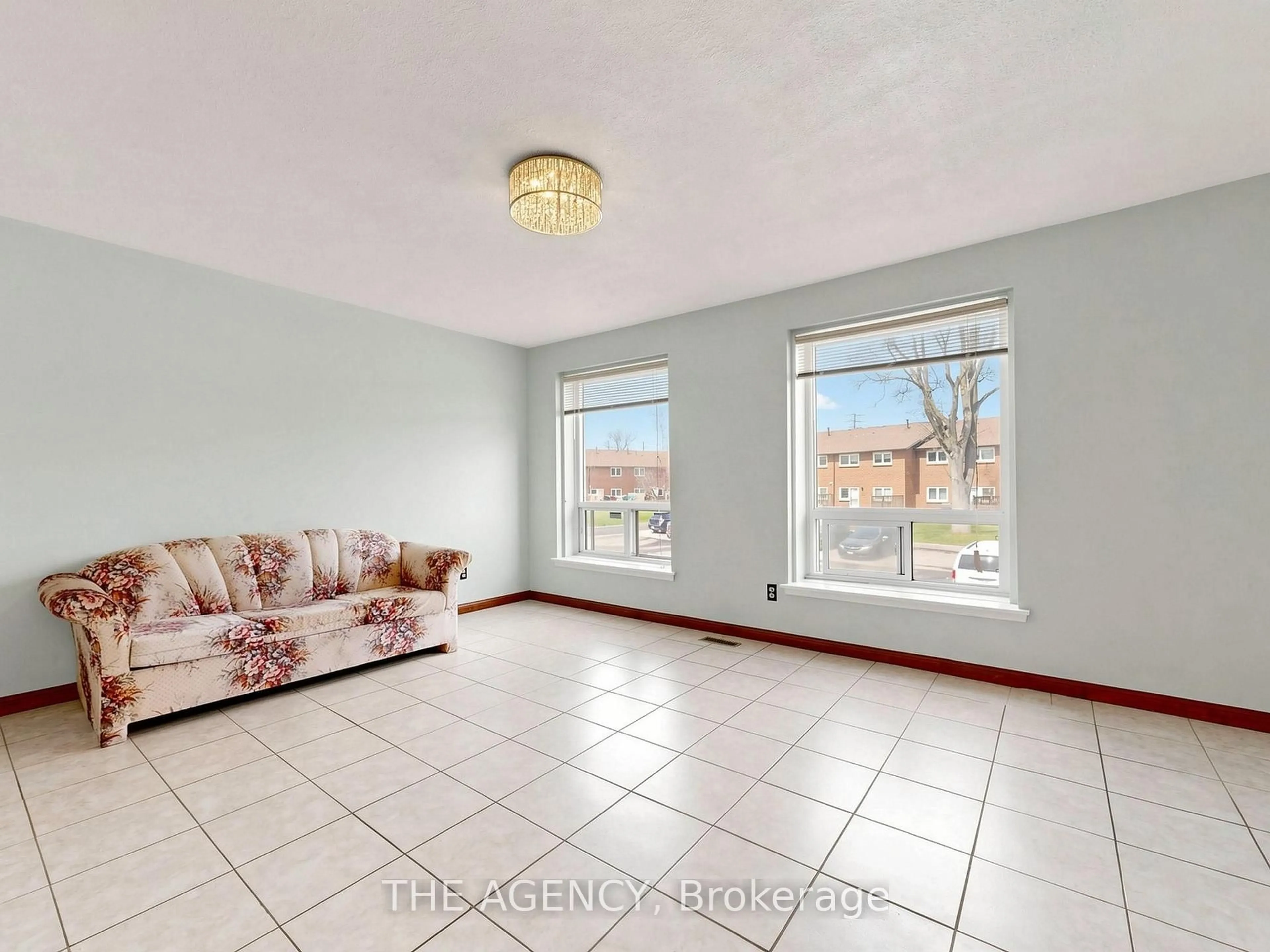 Living room with furniture, ceramic/tile floor for 1559 Albion Rd ##33, Toronto Ontario M9V 1B2