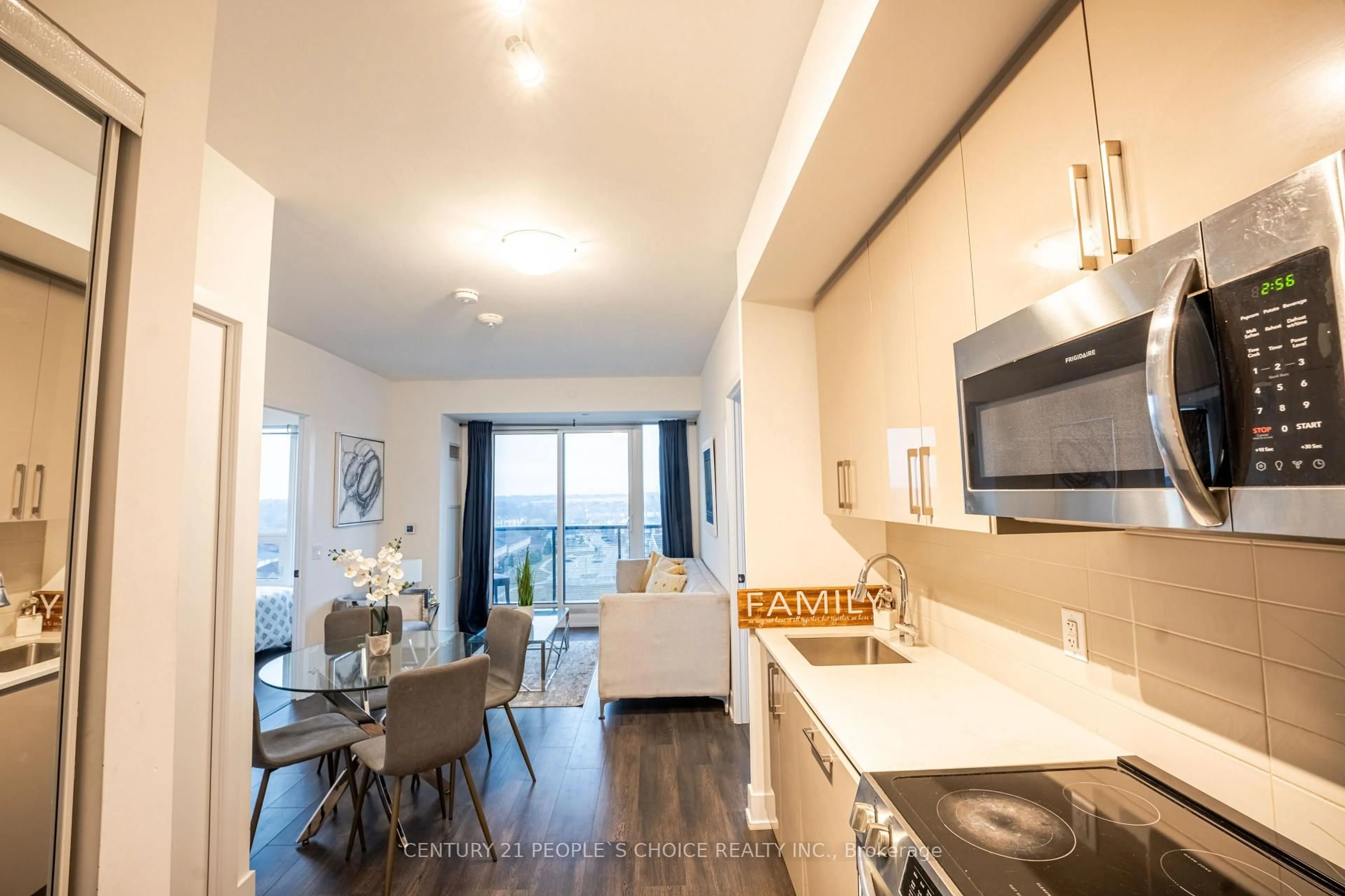 Open concept kitchen, wood/laminate floor for 2450 Old Bronte Rd #723, Oakville Ontario L6M 5P6