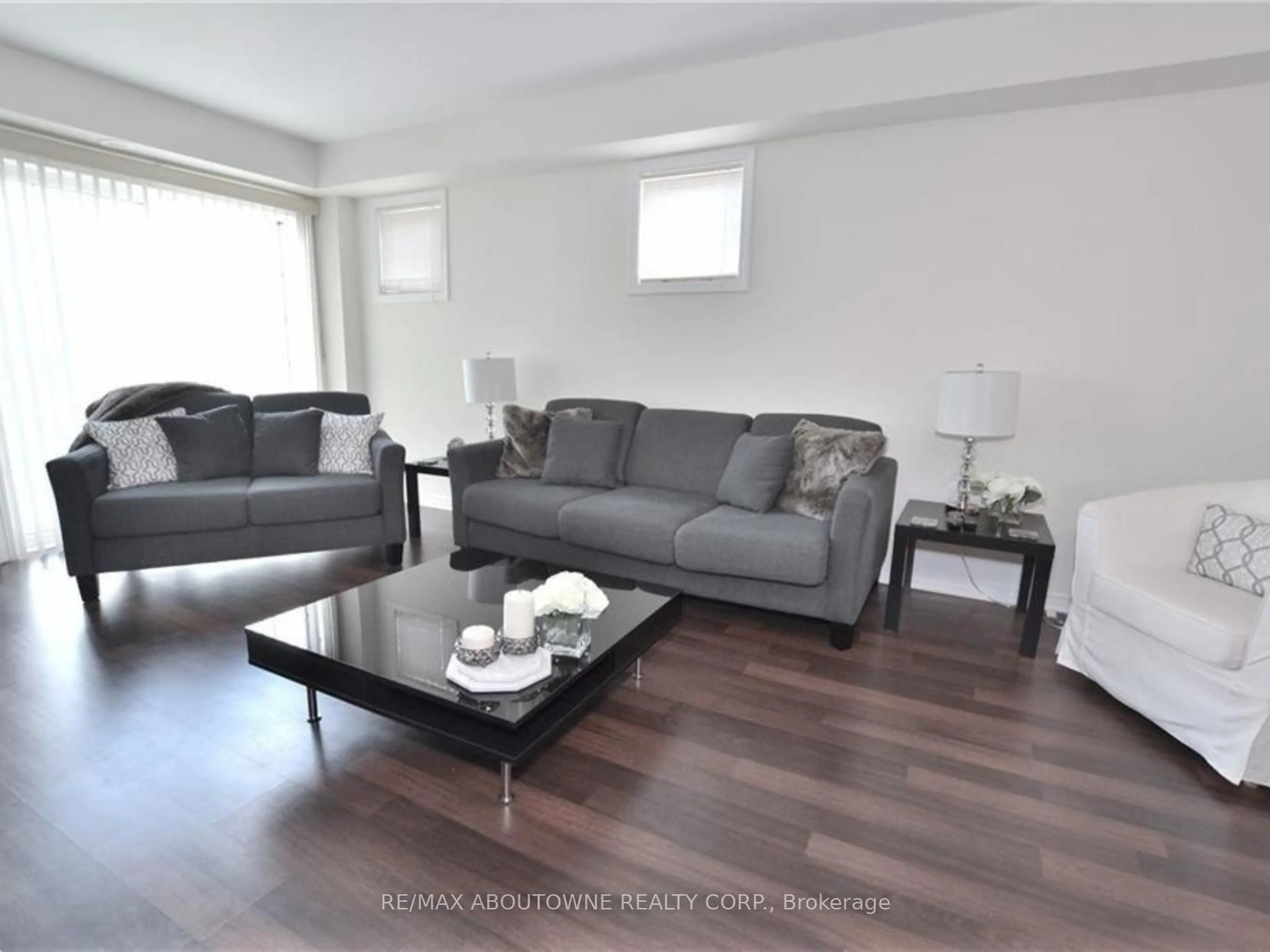 Living room with furniture, wood/laminate floor for 2441 Greenwich Dr #1, Oakville Ontario L6M 0S3