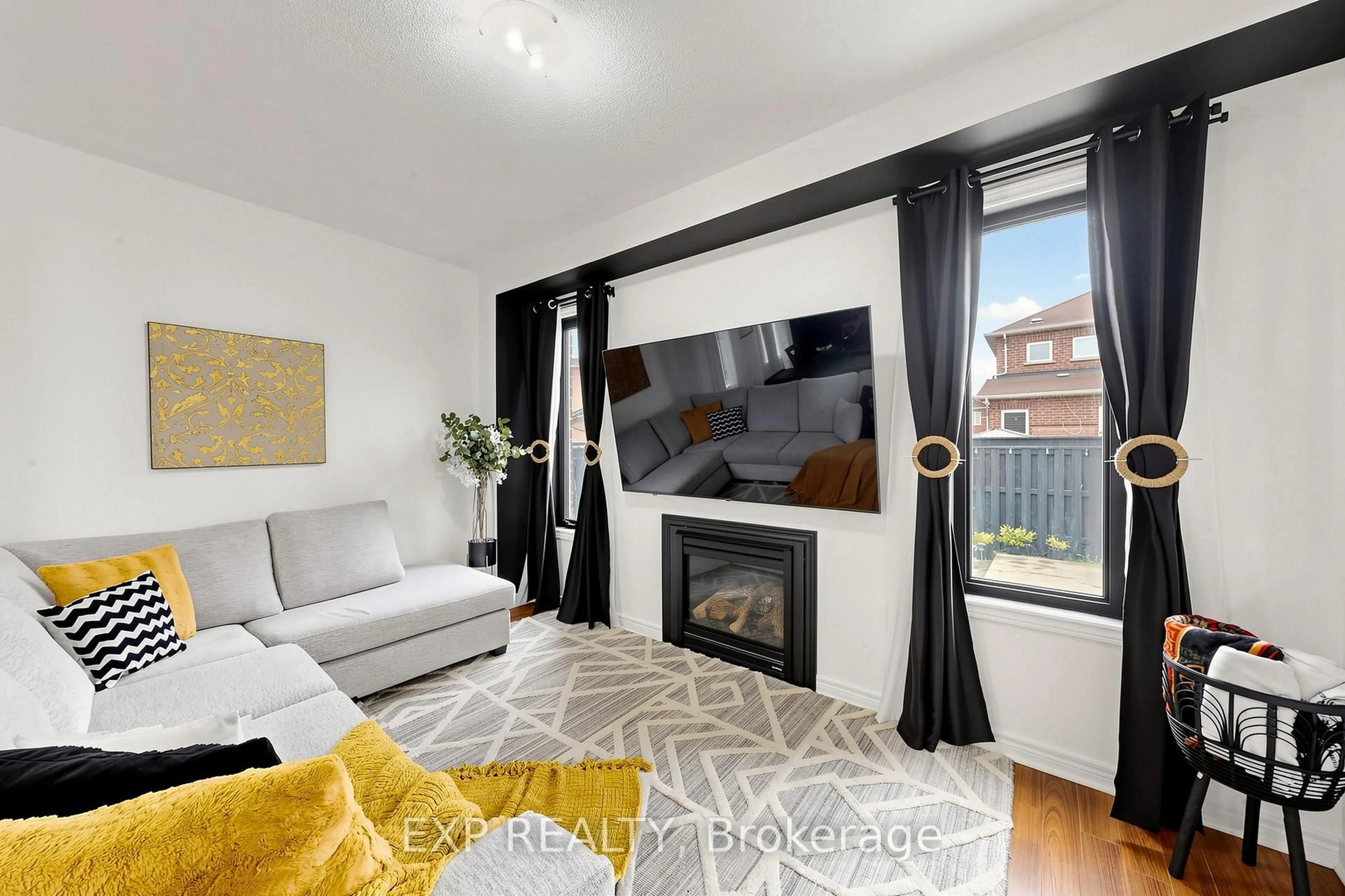 Living room with furniture, wood/laminate floor for 34 Freesia Rd, Brampton Ontario L7A 0N1