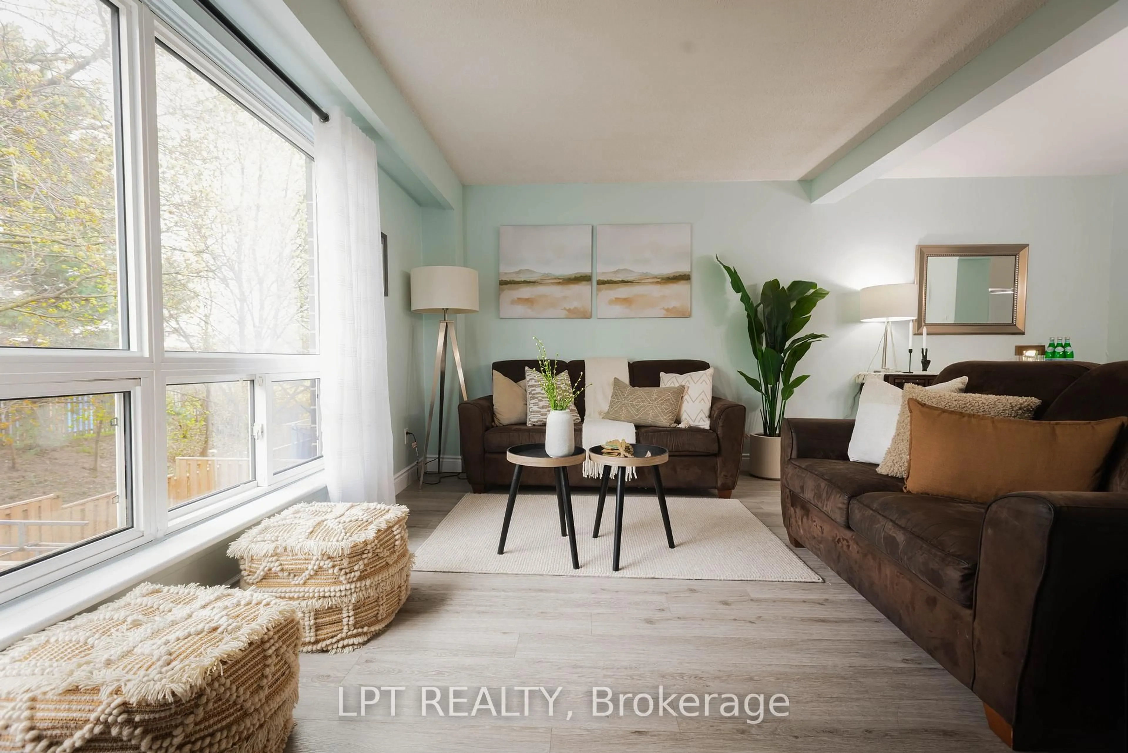Living room with furniture, wood/laminate floor for 318 Laurier Ave #3, Milton Ontario L9T 3M9