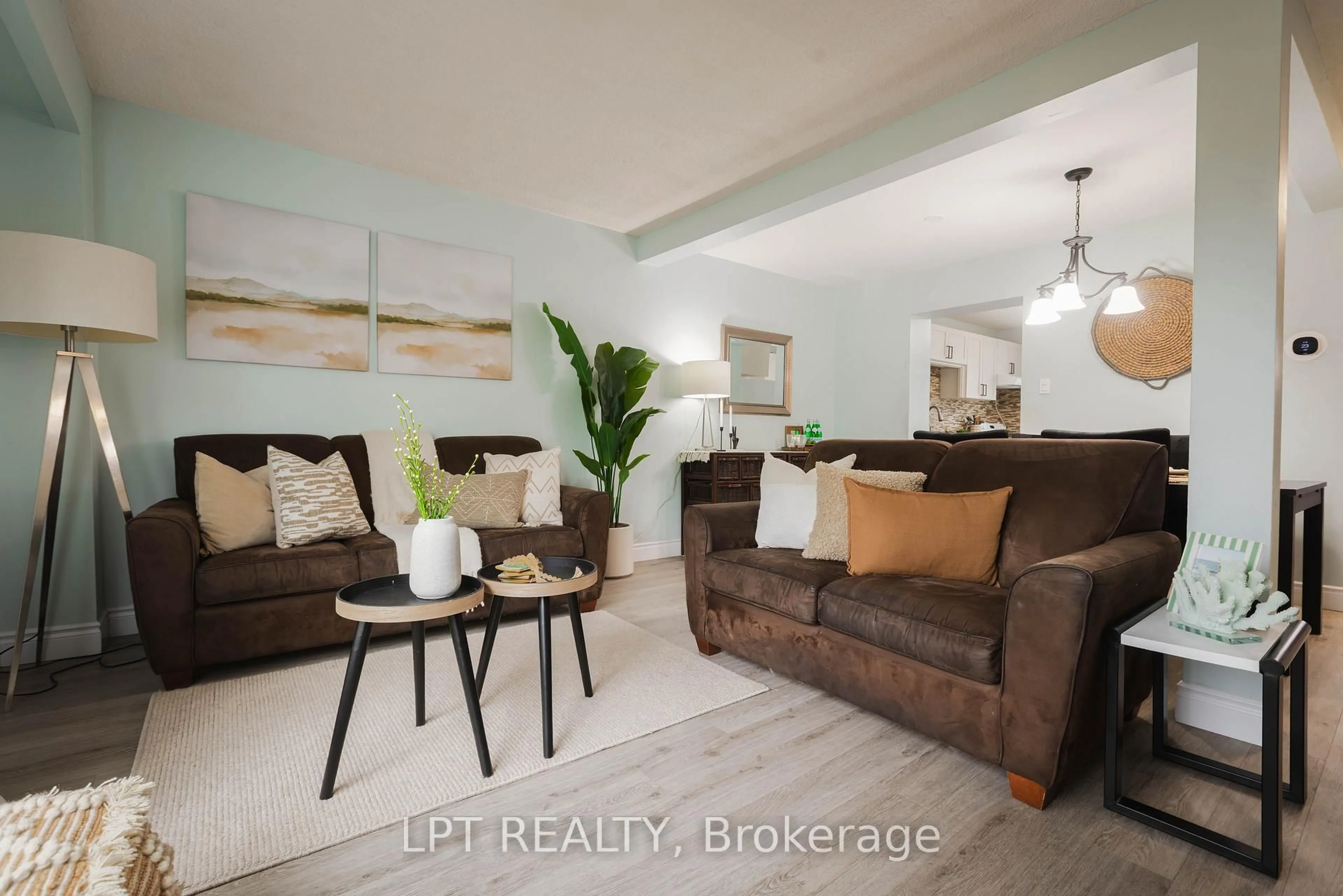 Living room with furniture, wood/laminate floor for 318 Laurier Ave #3, Milton Ontario L9T 3M9