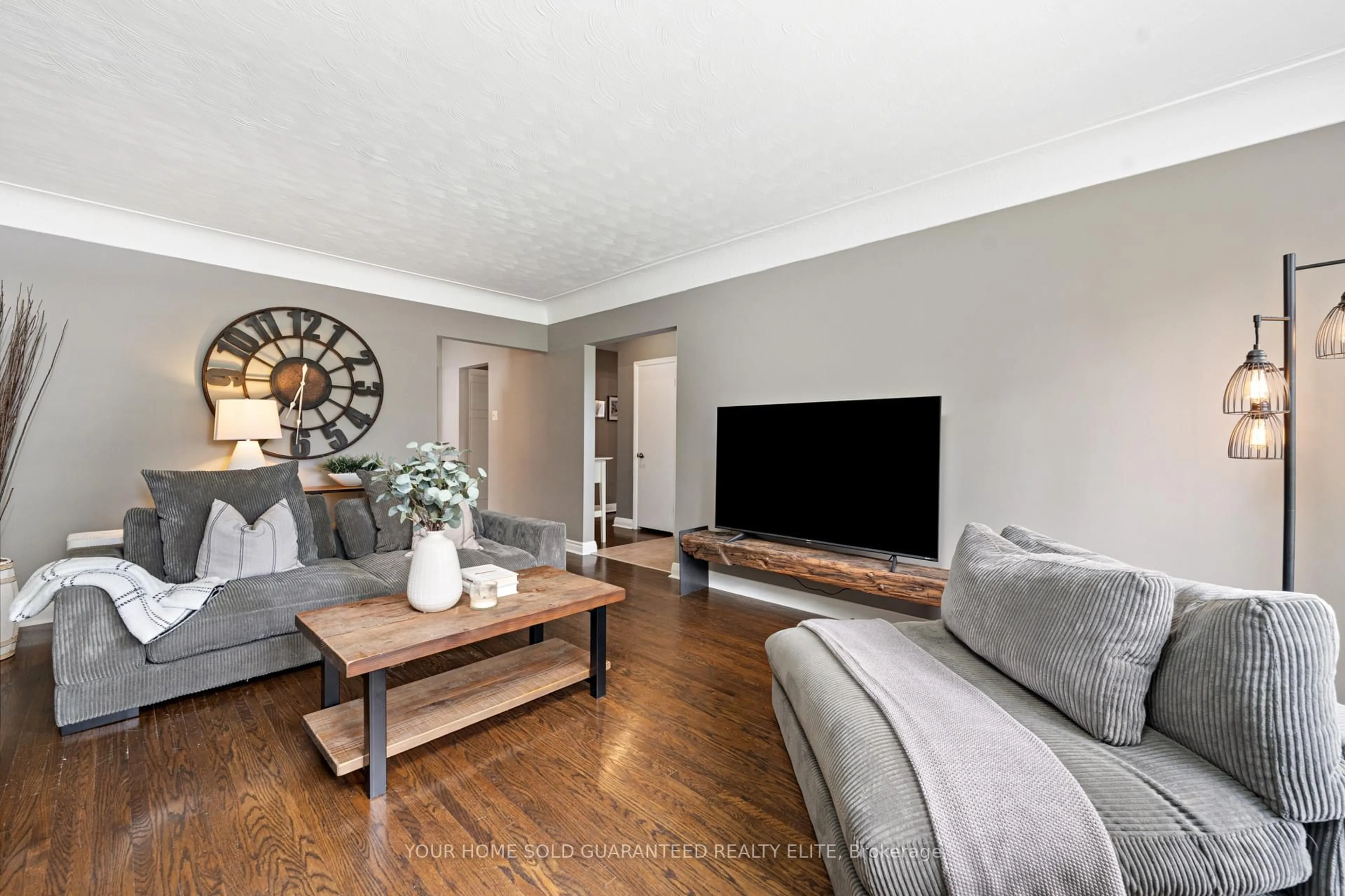 Living room with furniture, wood/laminate floor for 1063 Maplehurst Ave, Burlington Ontario L7T 3G3