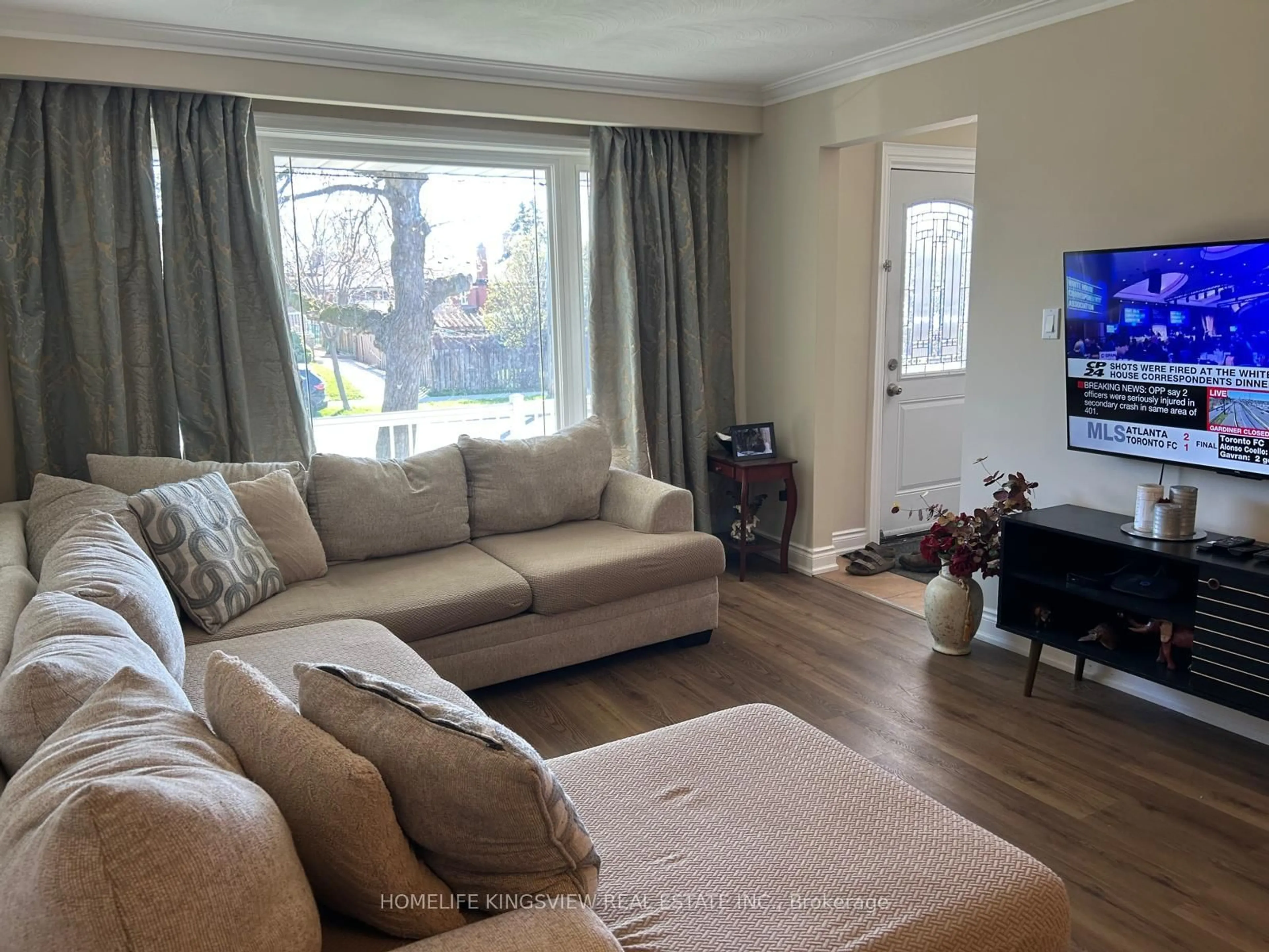 Living room with furniture, wood/laminate floor for 46 Clayhall Cres, Toronto Ontario M3J 1W6