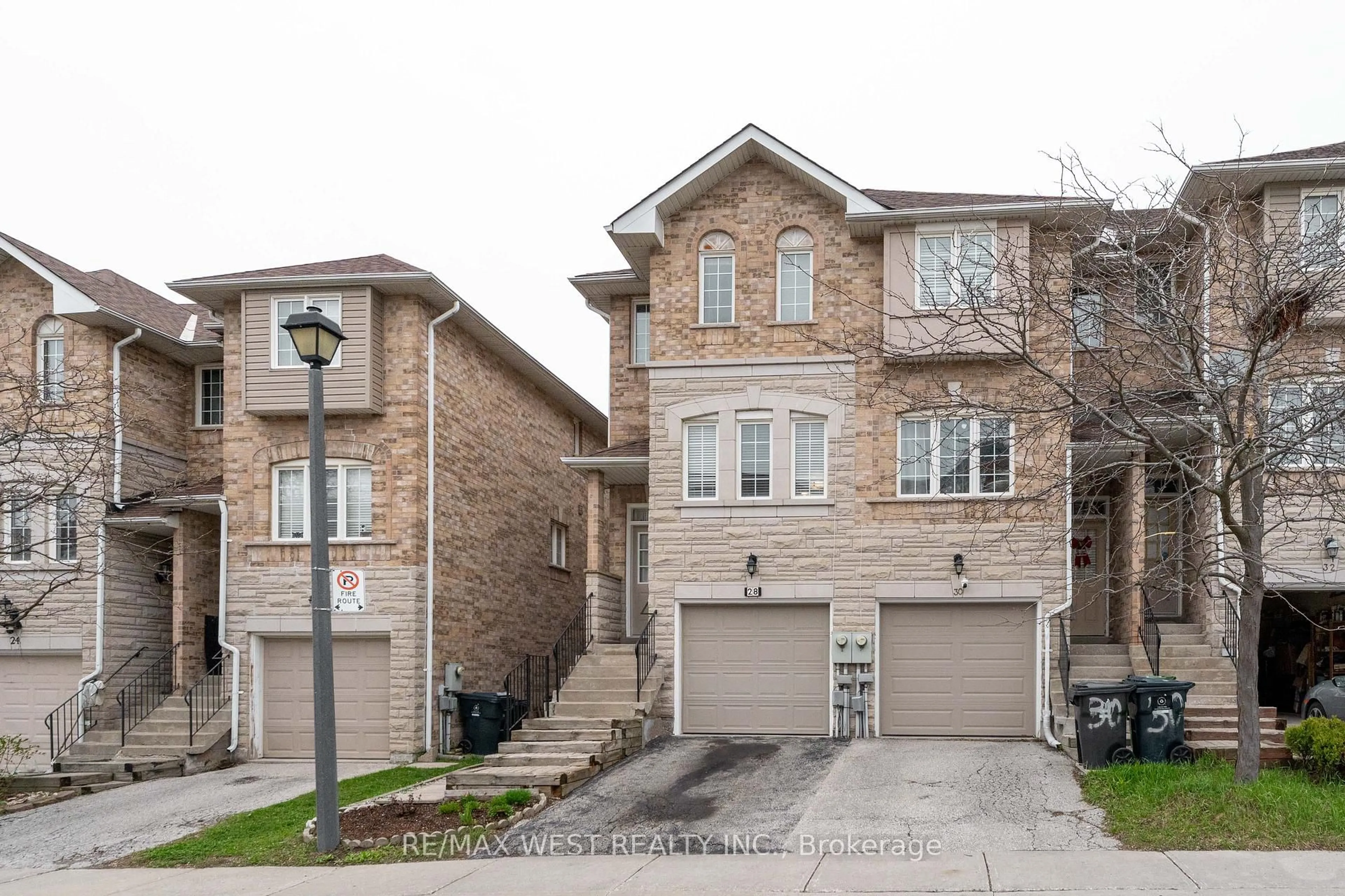 Home with brick exterior material, street for 28 Shining Star Cres #30, Toronto Ontario M6M 5L6