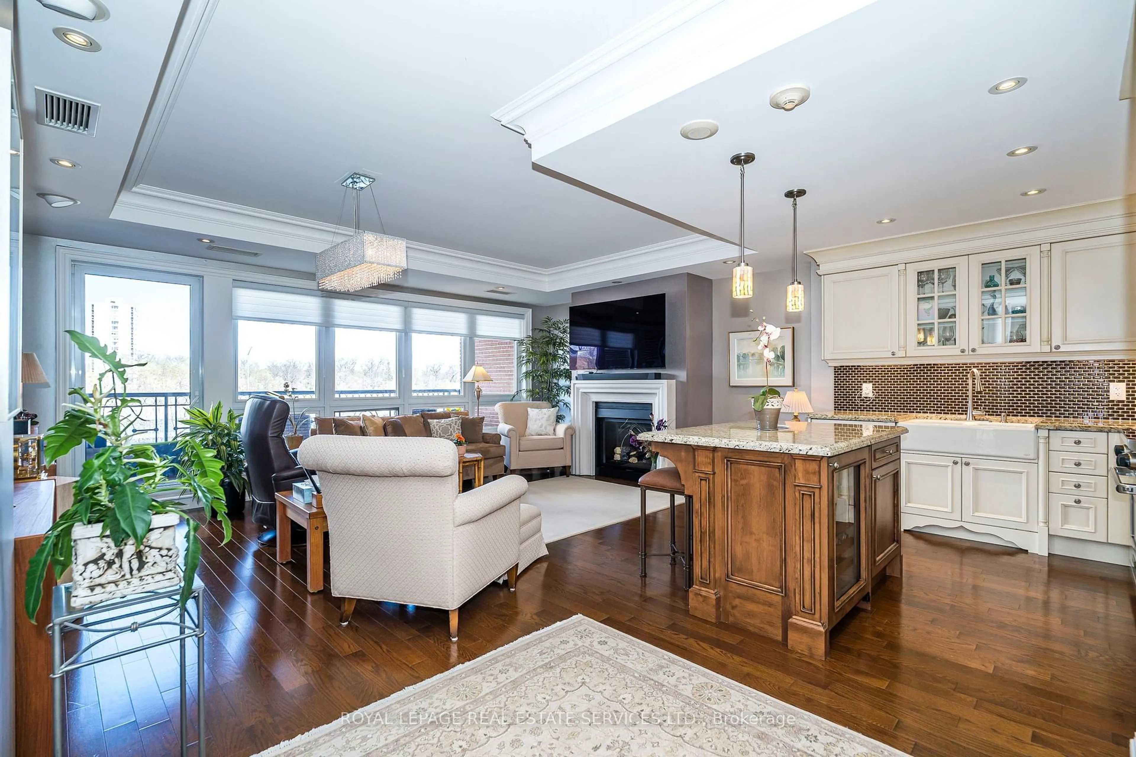 Open concept kitchen, wood/laminate floor for 111 Forsythe St #405, Oakville Ontario L6K 3J9