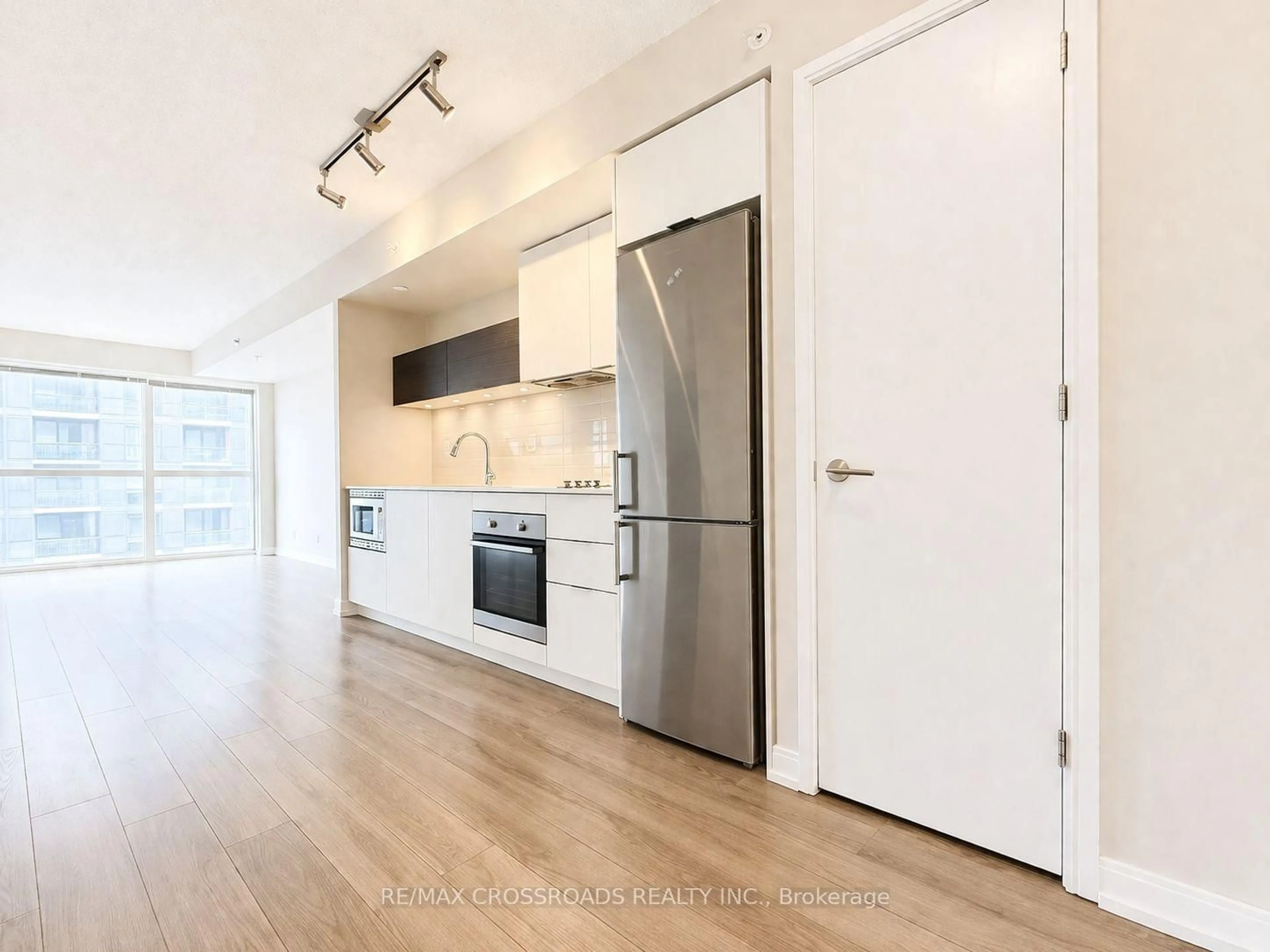 Open concept kitchen, wood/laminate floor for 20 Thomas Riley Rd #1201, Toronto Ontario M9B 0C3