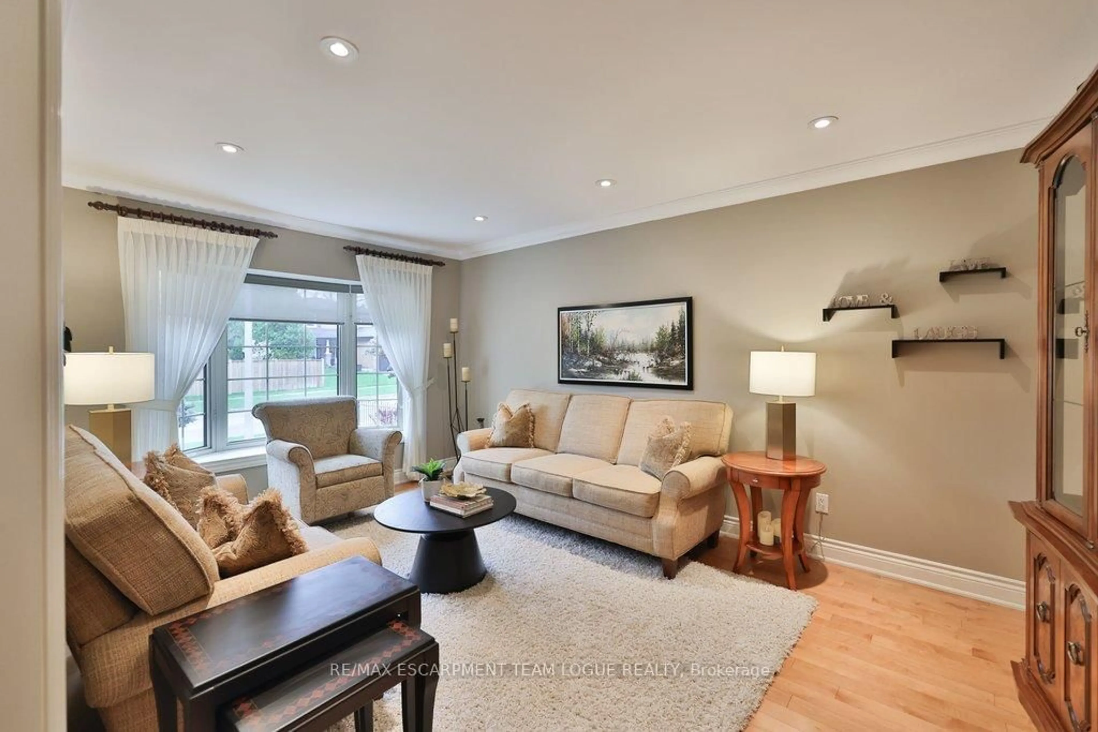 Living room with furniture, wood/laminate floor for 2041 Summer Wind Dr, Burlington Ontario L7M 2V2