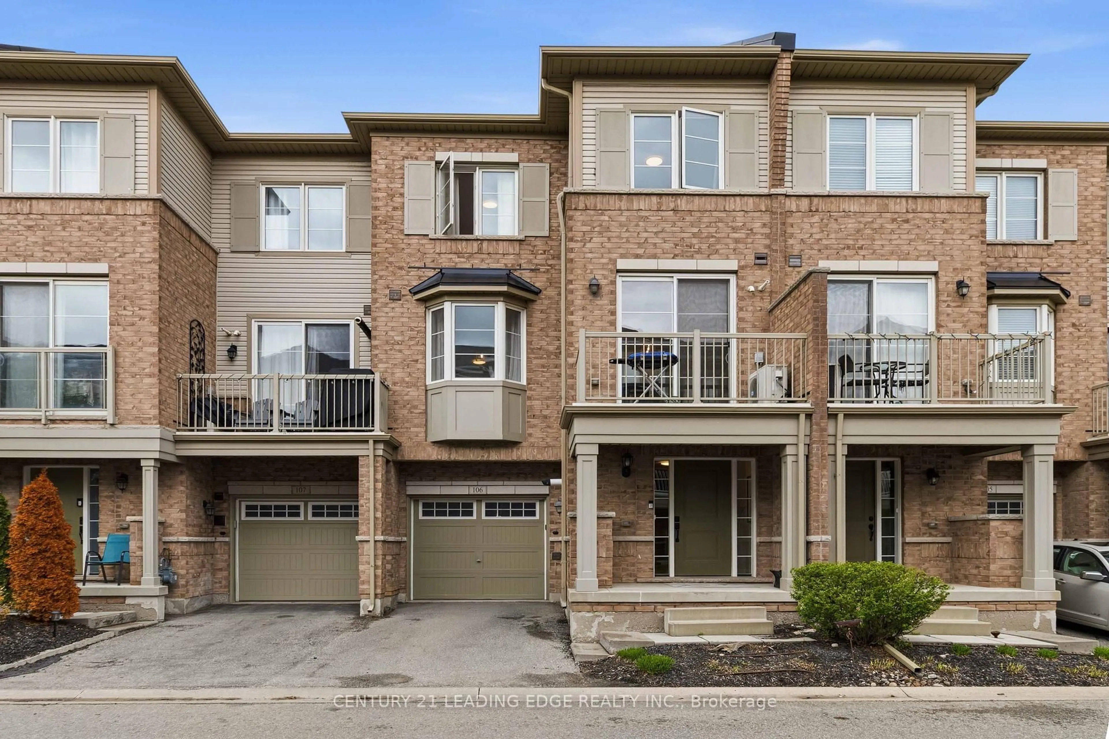 Home with brick exterior material, street for 165 Hampshire Way #106, Milton Ontario L9T 8M7