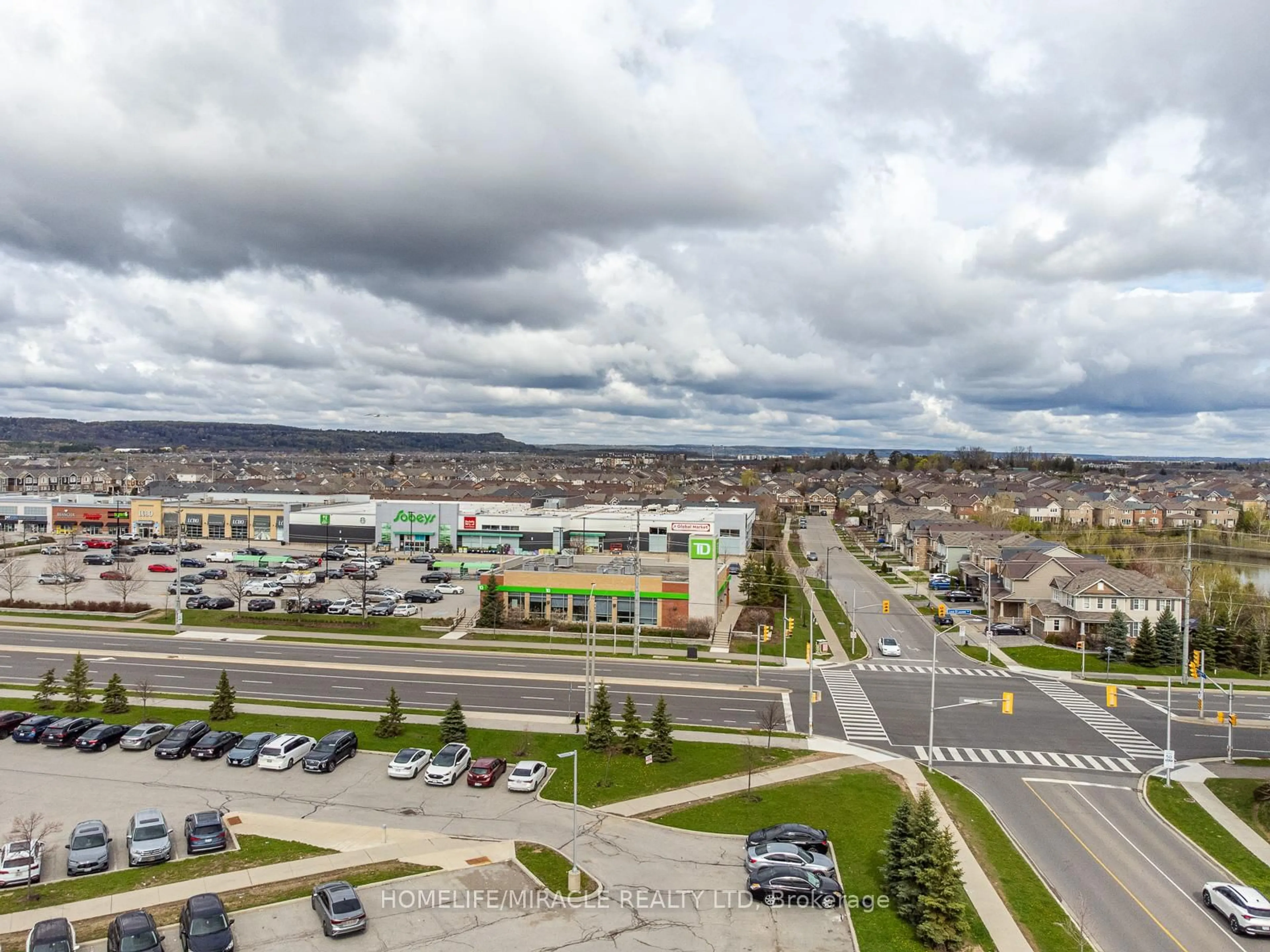 A pic from outside/outdoor area/front of a property/back of a property/a pic from drone, mountain view for 1105 Leger Way #421, Milton Ontario L9E 1K7