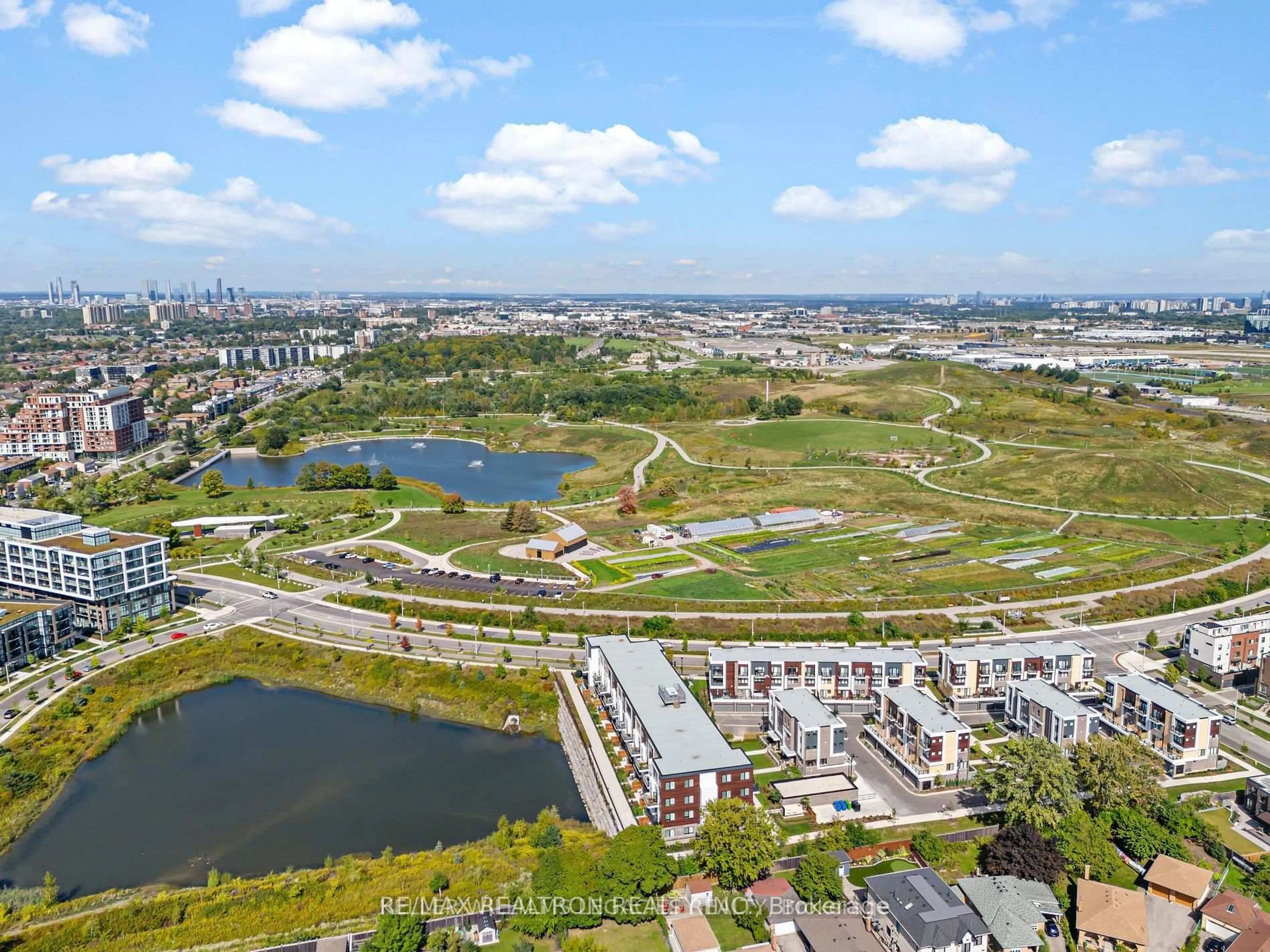 A pic from outside/outdoor area/front of a property/back of a property/a pic from drone, water/lake/river/ocean view for 155 Downsview Park Blvd #206, Toronto Ontario M3K 0E3