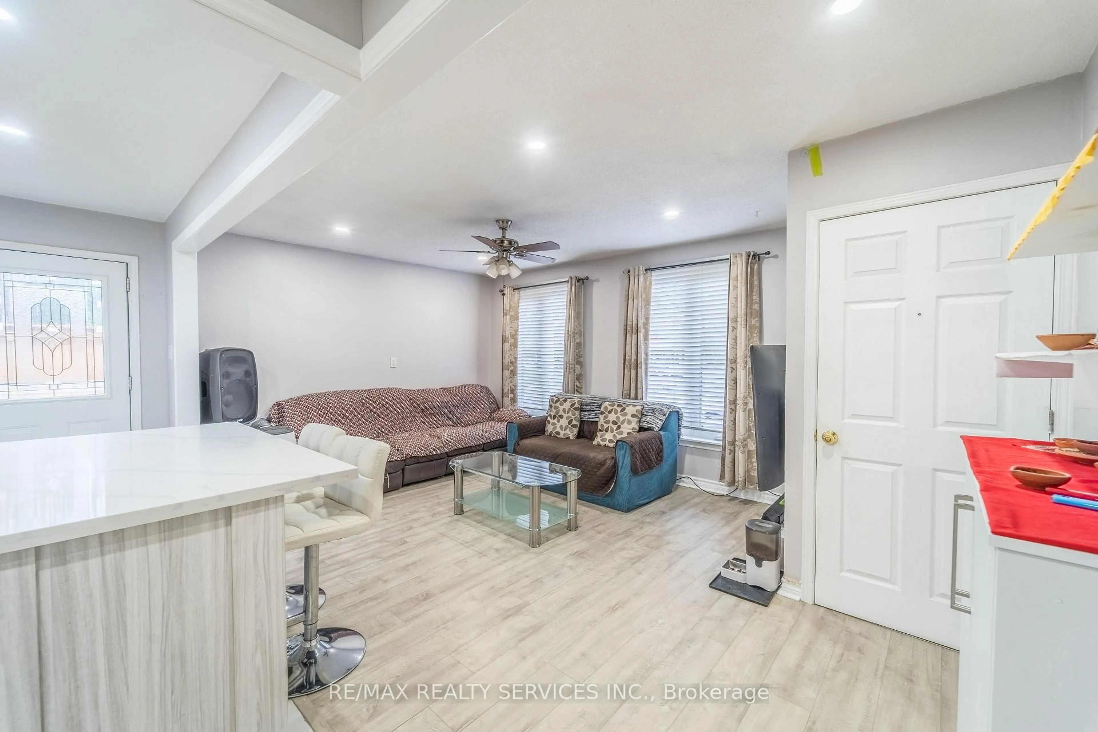 Living room with furniture, wood/laminate floor for 23 Dawson Rd, Orangeville Ontario L9W 3T9