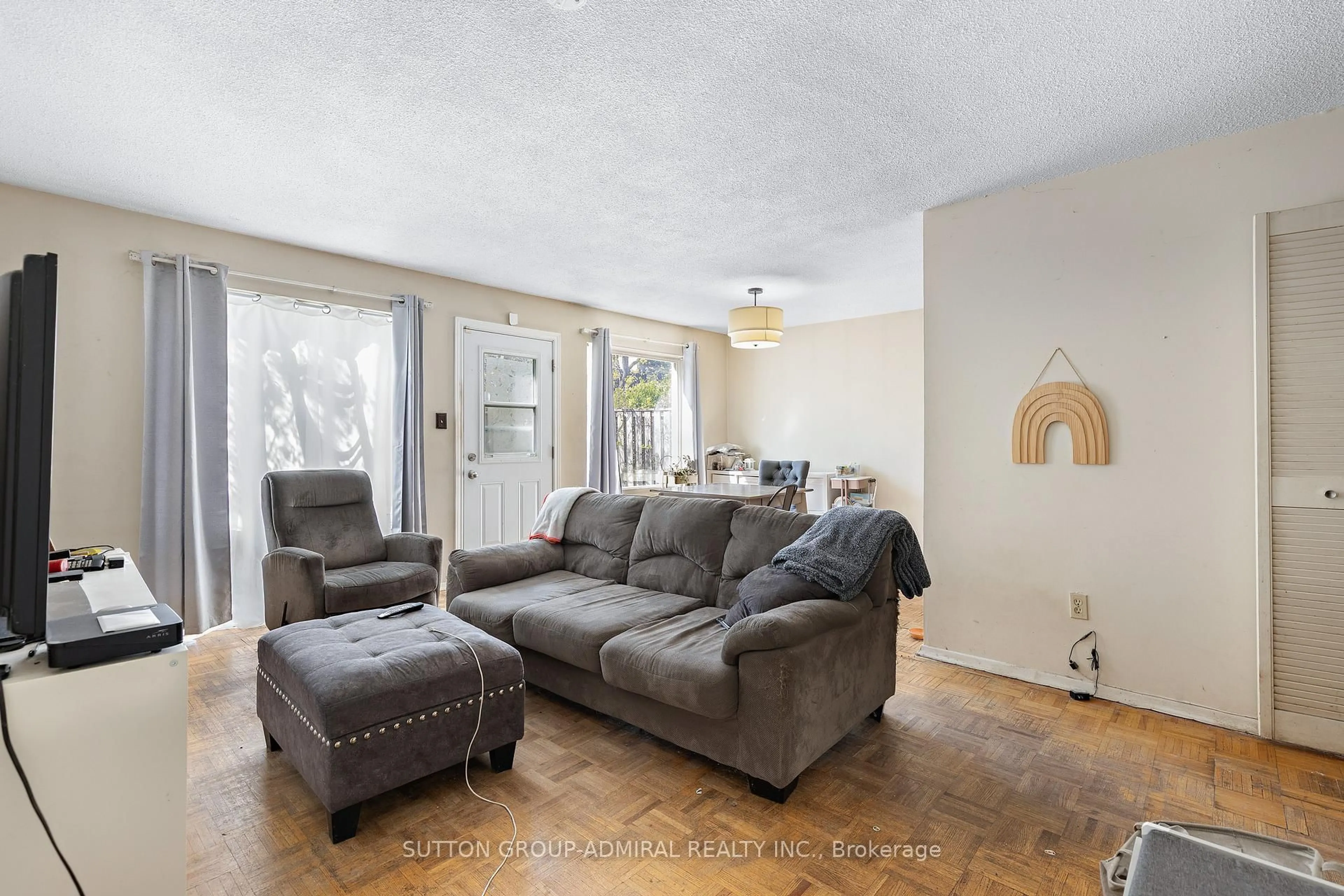 Living room with furniture, unknown for 21 Four Winds Dr #11, Toronto Ontario M3J 1K7
