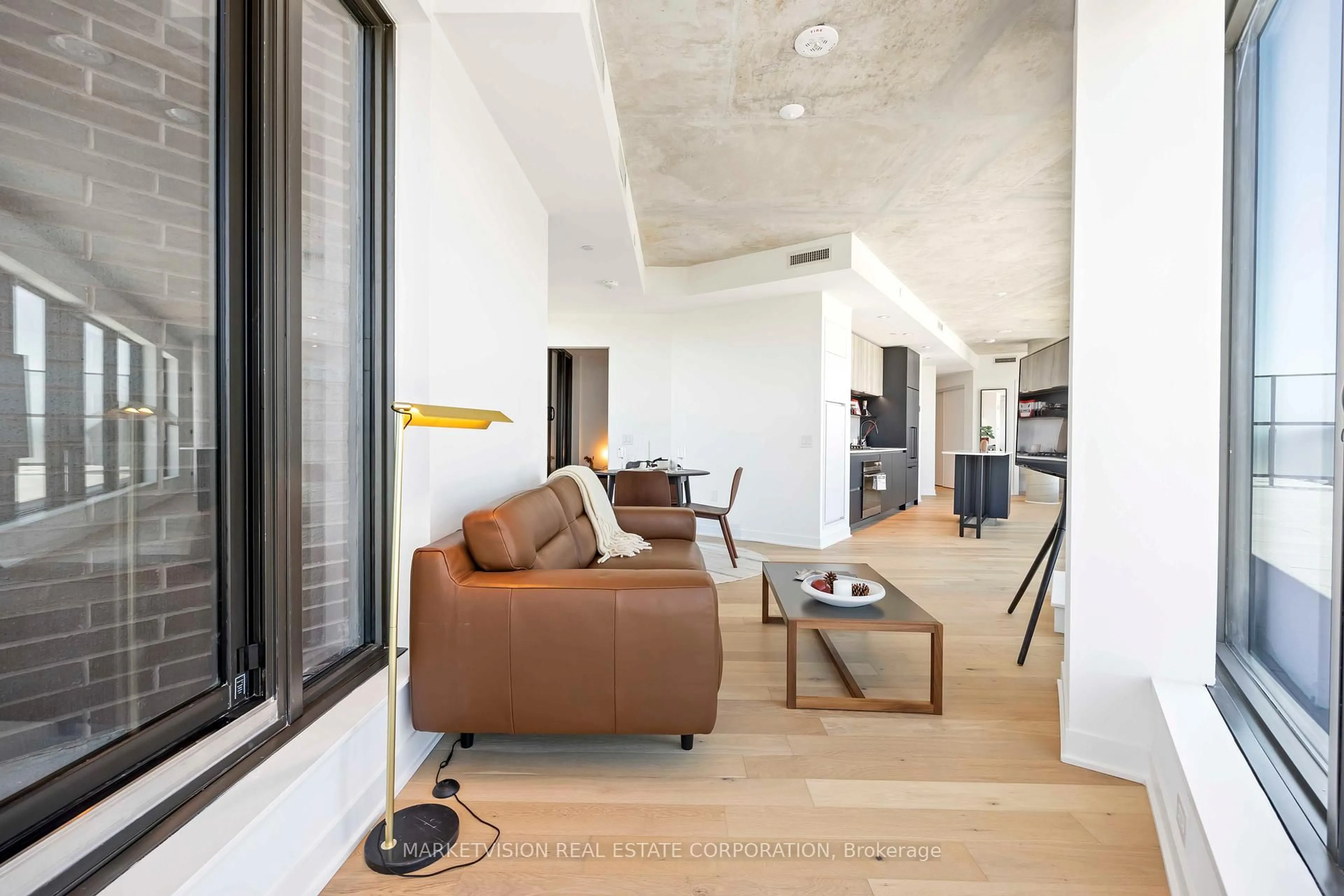 Living room with furniture, cement floor for 2625 Dundas St #705, Toronto Ontario M6P 0C5