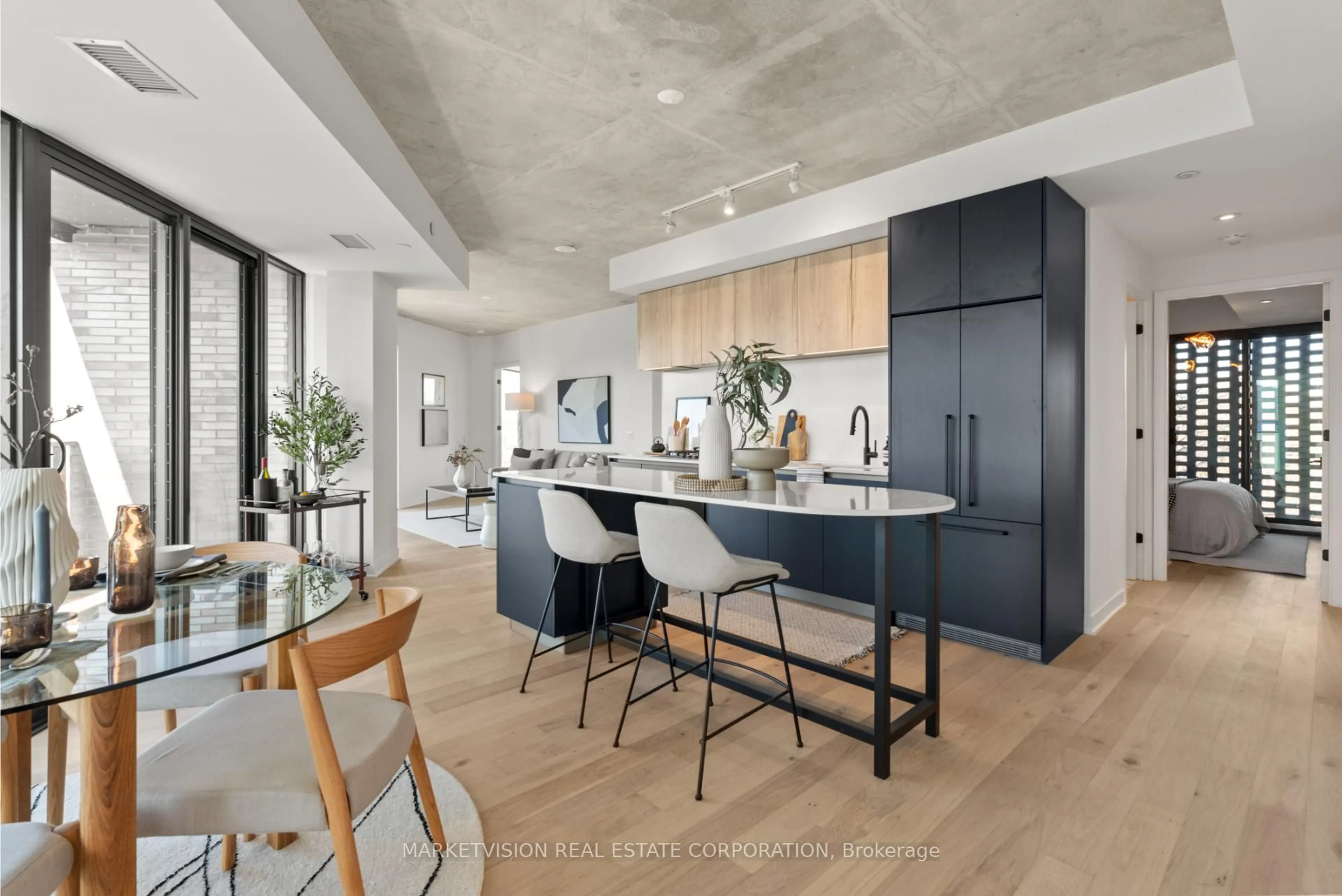 Open concept kitchen, cement floor for 2625 Dundas St #405, Toronto Ontario M6P 0C5
