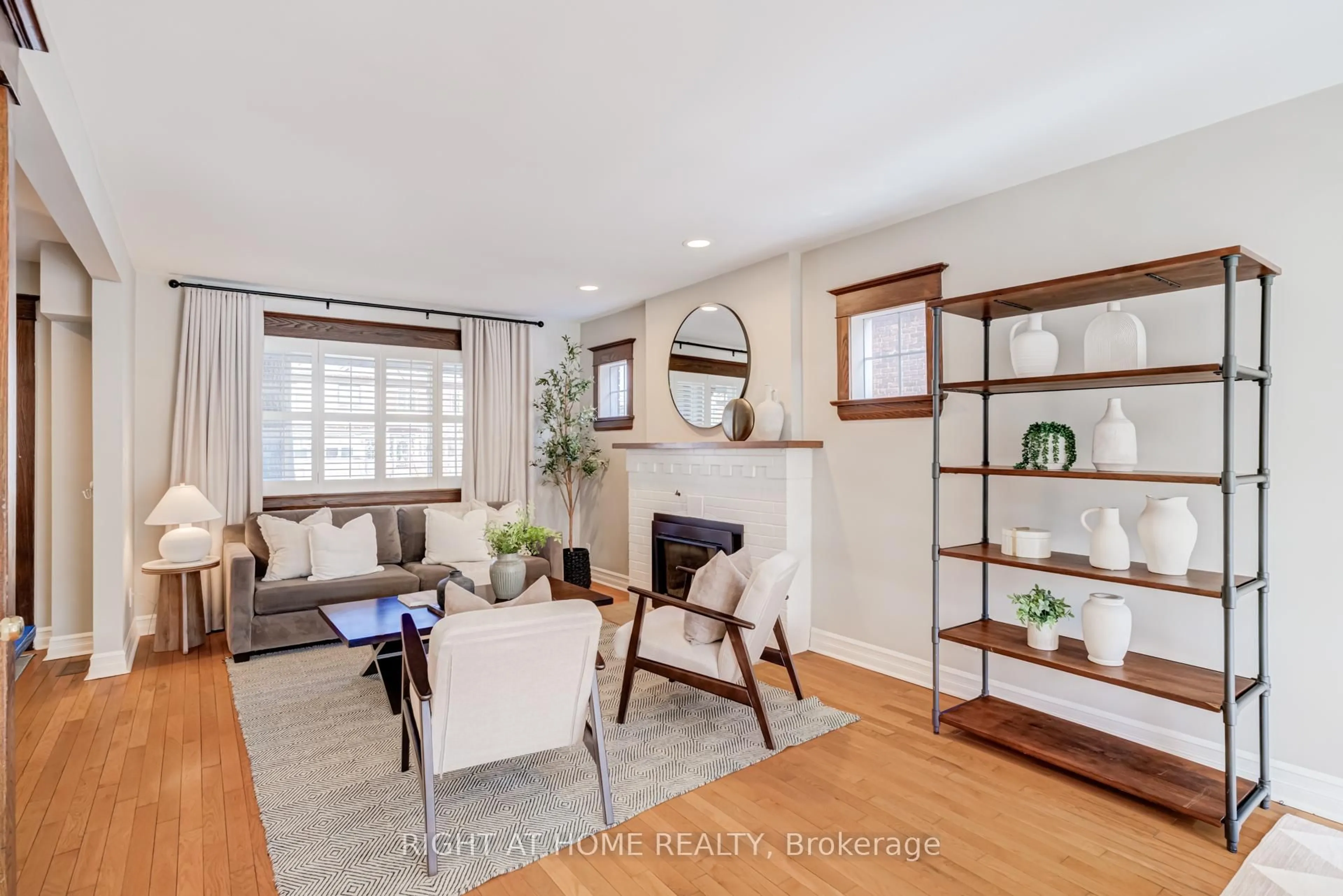 Living room with furniture, wood/laminate floor for 82 Ninth St, Toronto Ontario M8V 3E4