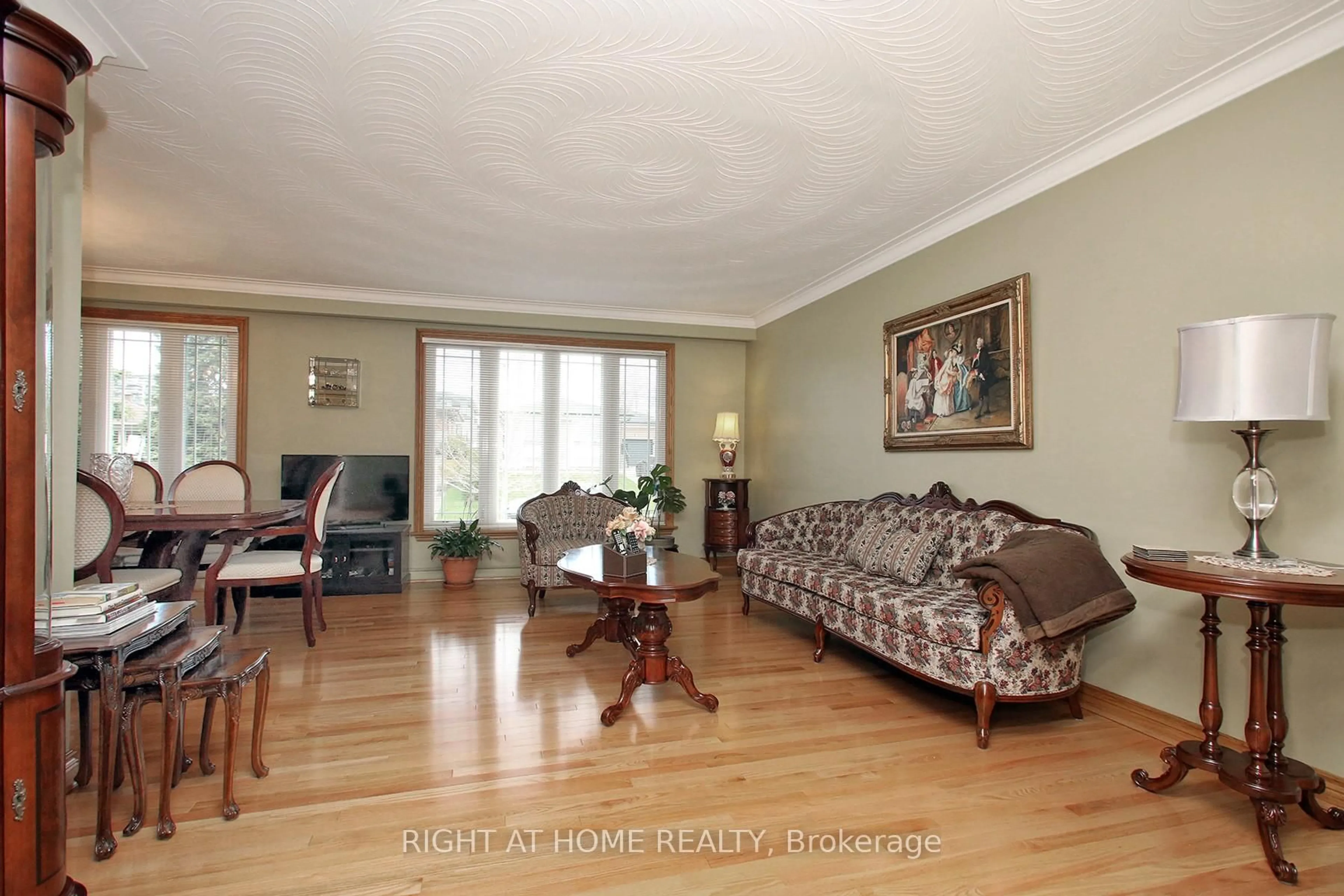 Living room with furniture, wood/laminate floor for 25 Sparrow Ave, Toronto Ontario M6A 1L5