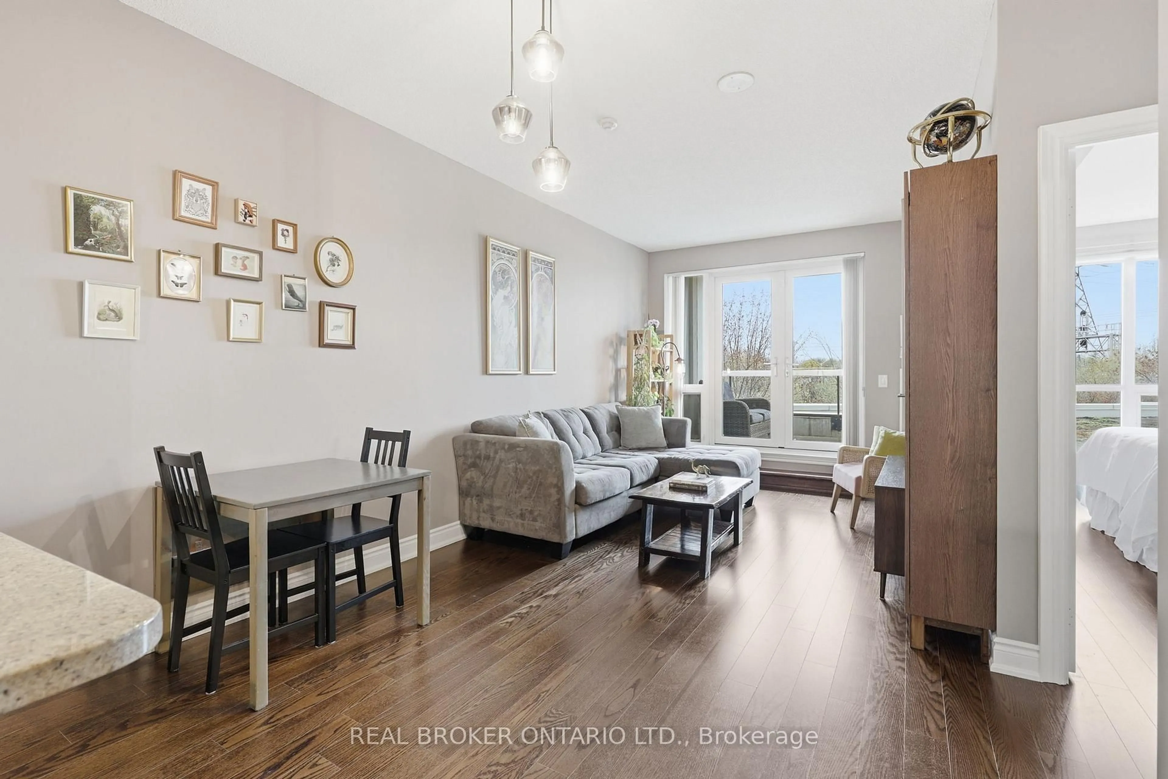 Living room with furniture, wood/laminate floor for 1135 Royal York Rd #205, Toronto Ontario M9A 0C3