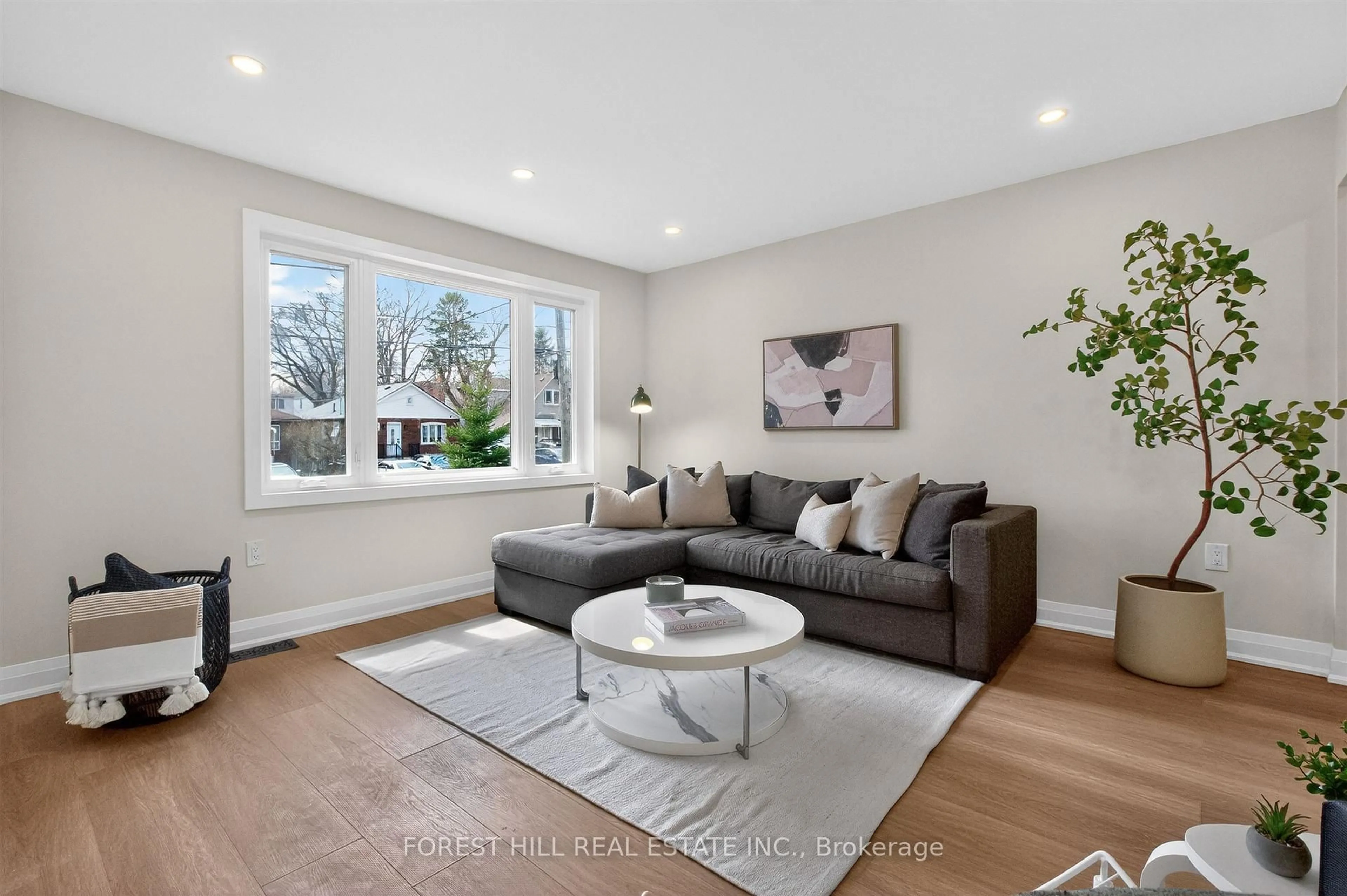 Living room with furniture, wood/laminate floor for 17 Alexander St, Toronto Ontario M8V 2K7