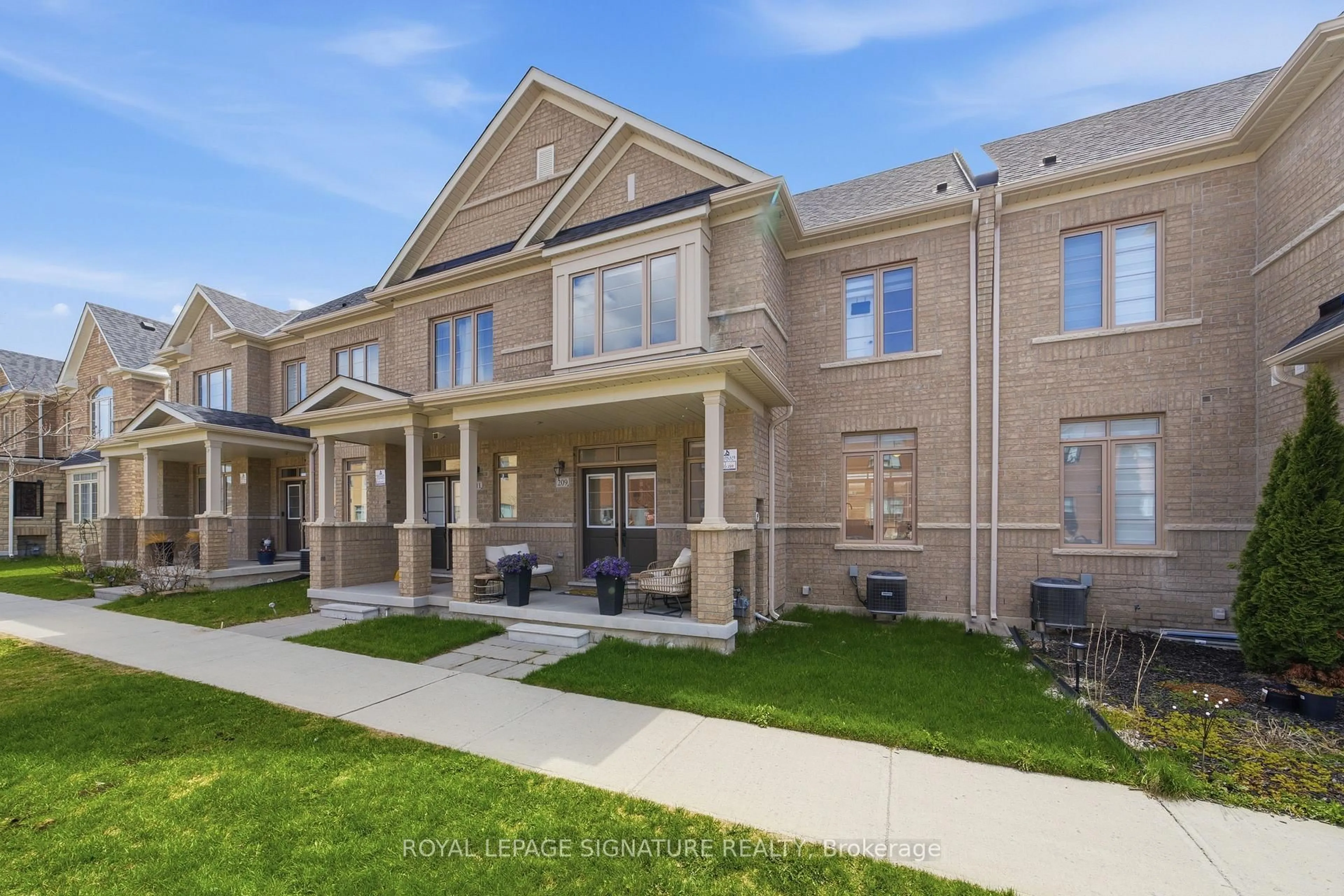 Home with brick exterior material, street for 209 Clockwork Dr, Brampton Ontario L7A 5C7