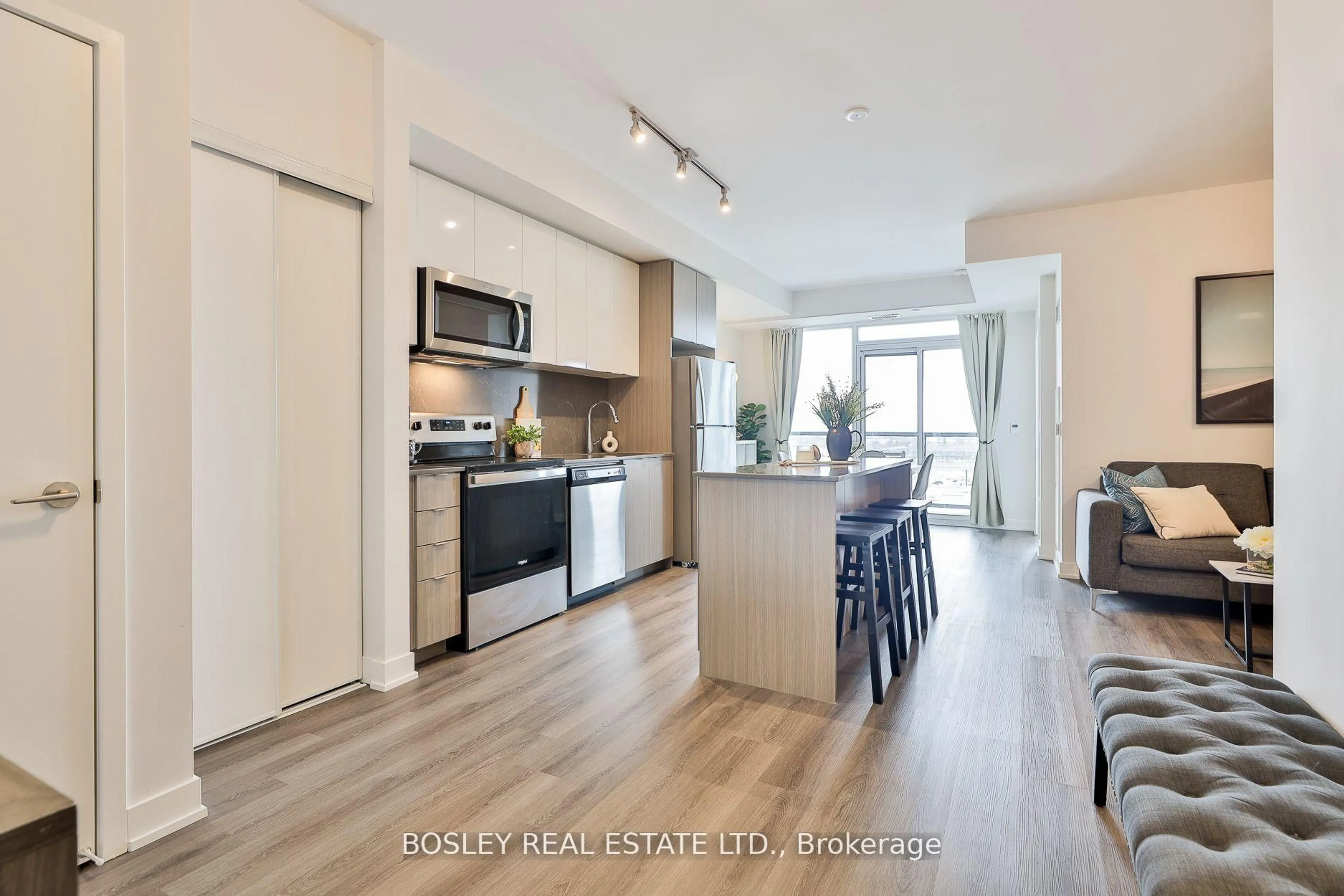 Open concept kitchen, wood/laminate floor for 859 The Queensway #612, Toronto Ontario M8Z 1N8