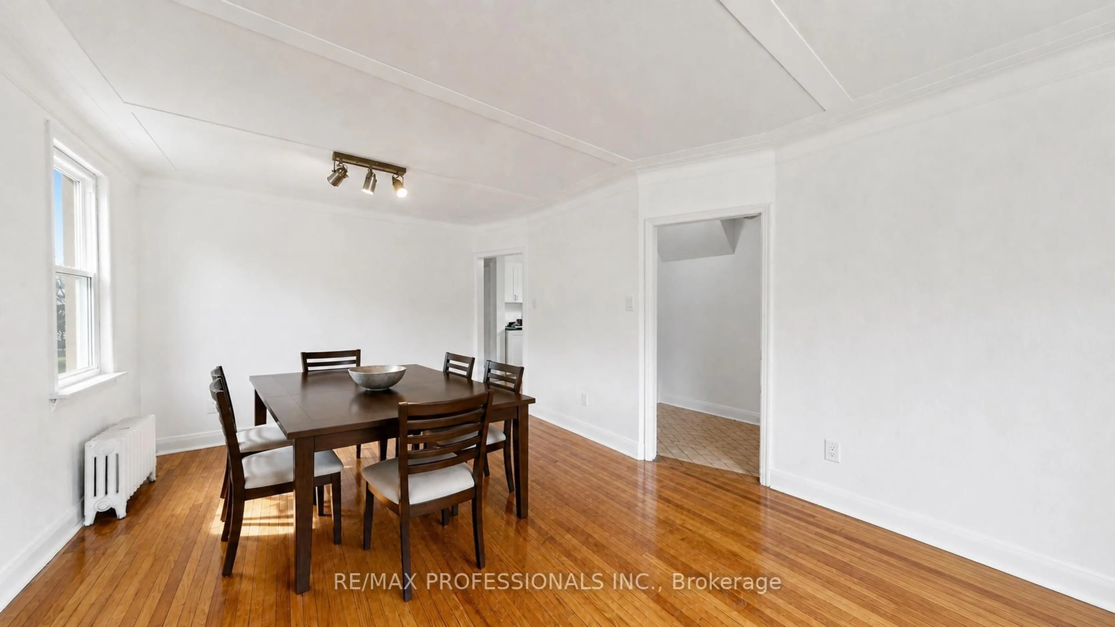 Dining room, wood/laminate floor for 5 Thirty Ninth St, Toronto Ontario M8W 3M4