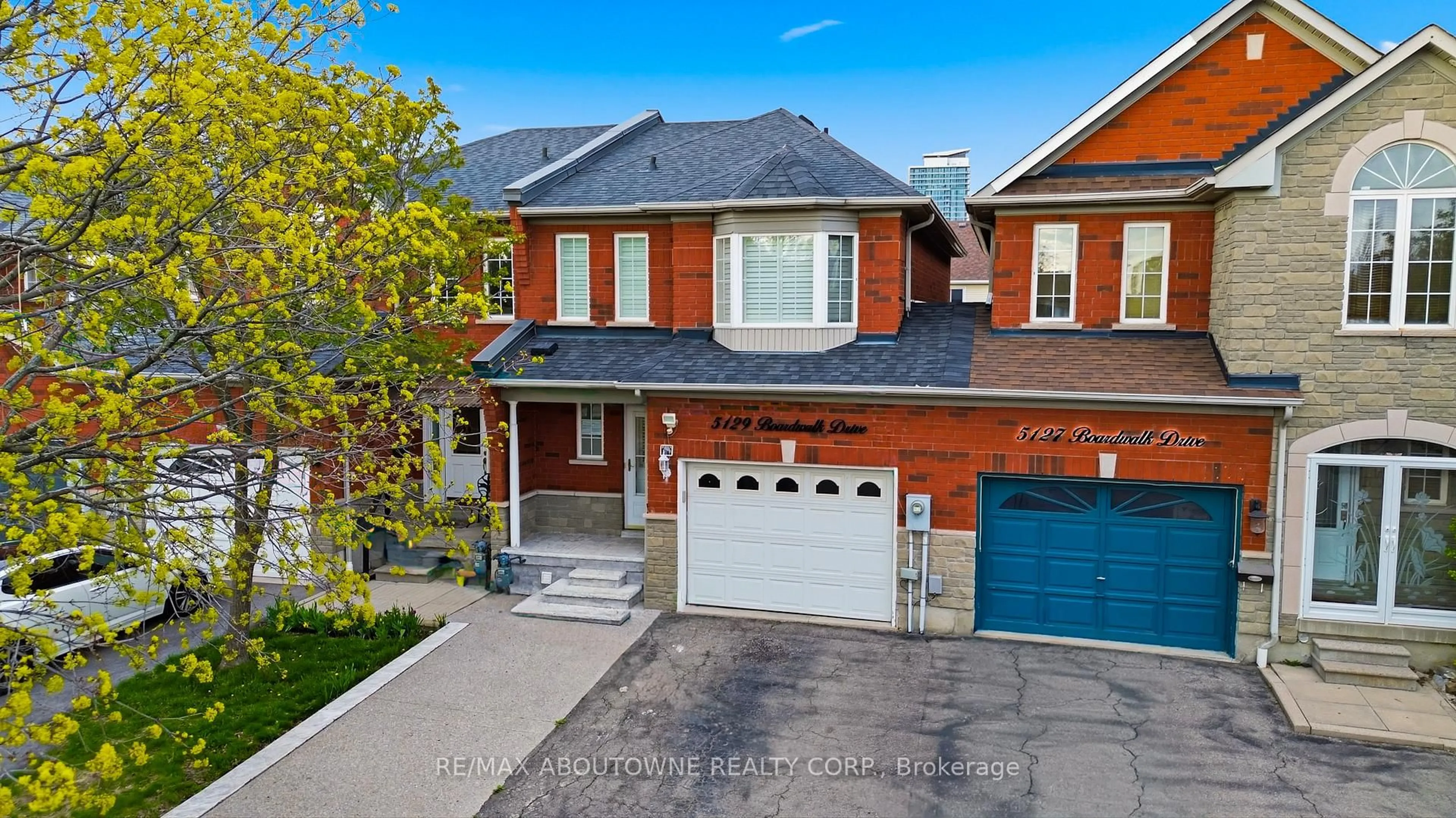 Home with brick exterior material, street for 5129 Boardwalk Dr, Mississauga Ontario L5R 3X7