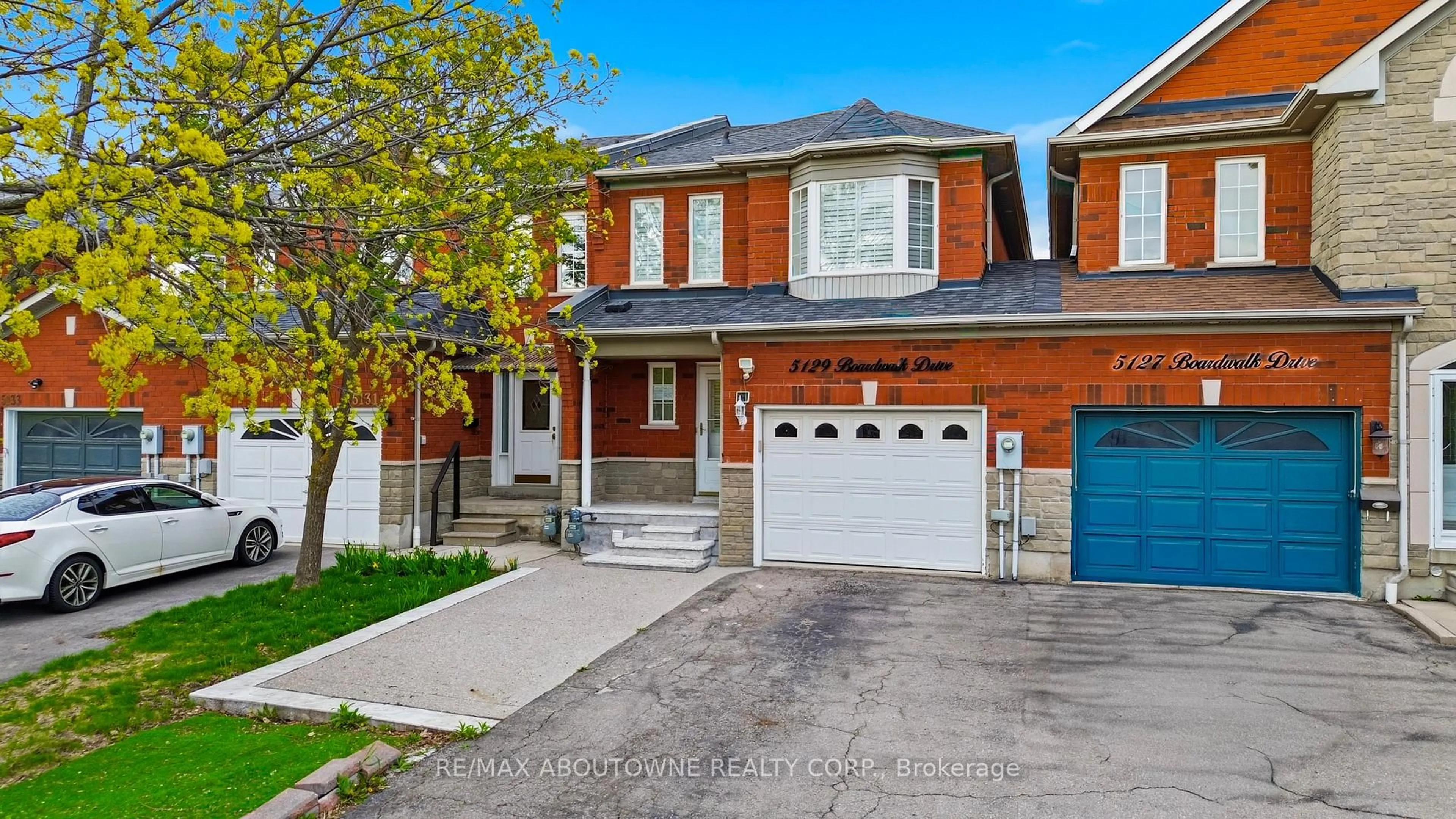 Home with brick exterior material, street for 5129 Boardwalk Dr, Mississauga Ontario L5R 3X7