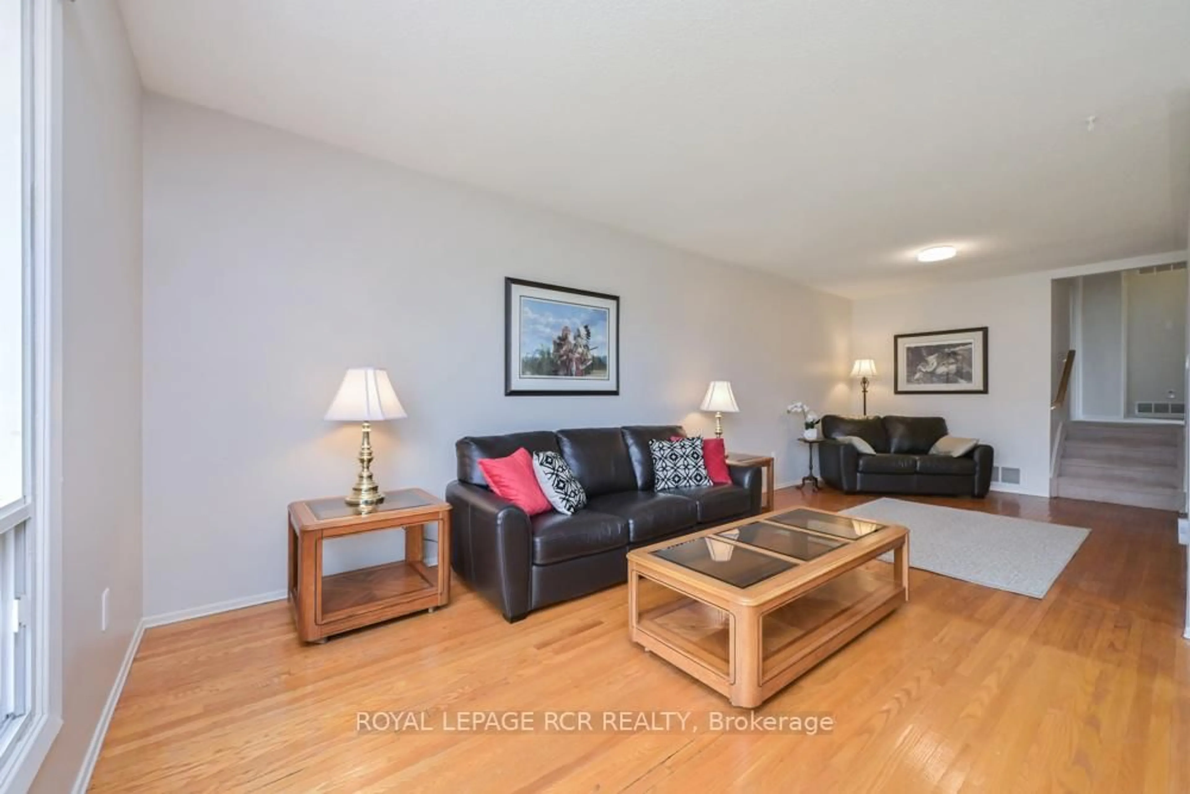 Living room with furniture, wood/laminate floor for 52 Ellwood Dr, Caledon Ontario L7E 2A5
